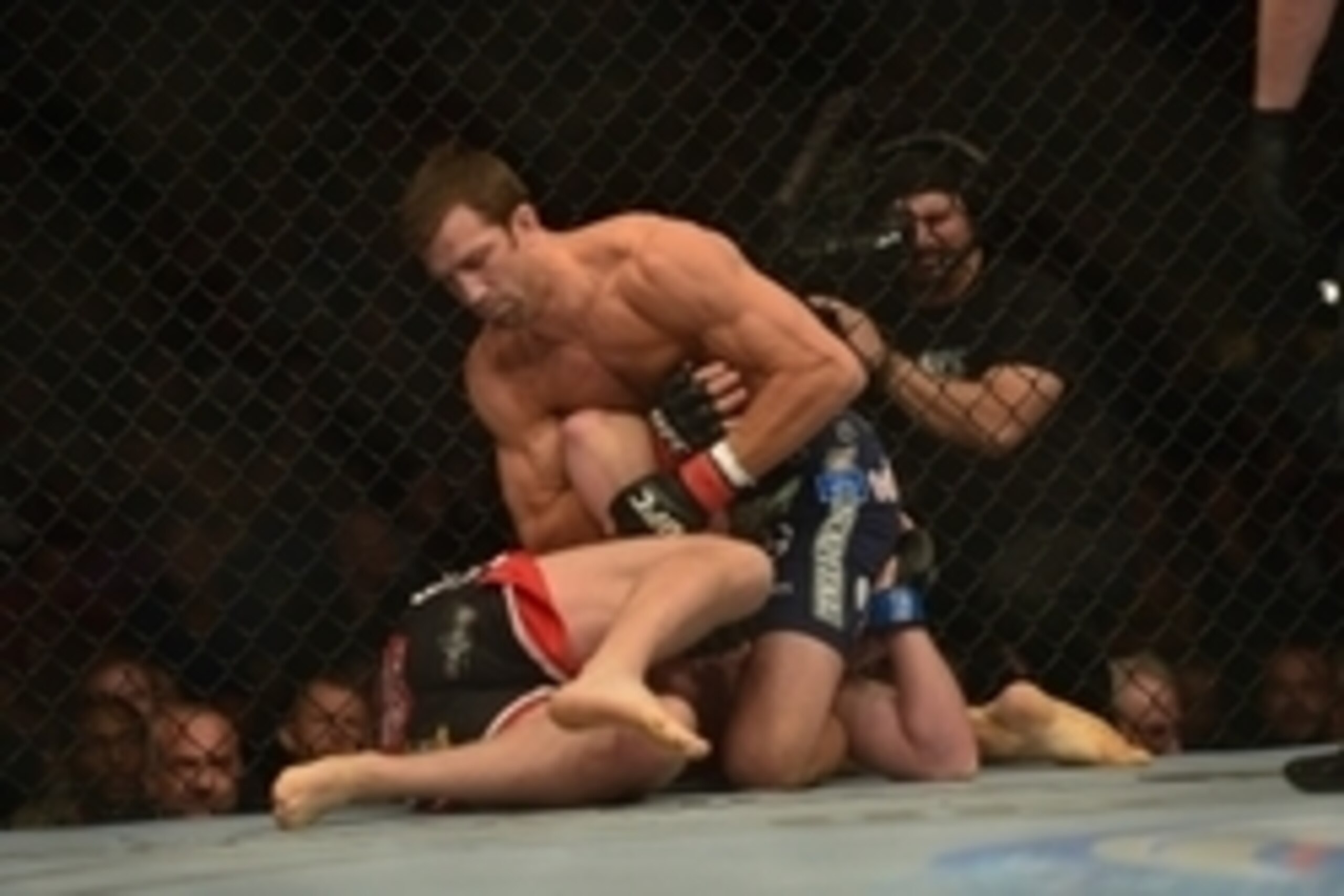 Apr 26, 2014; Baltimore, MD, USA;  Luke Rockhold (top) Tim Boetschat grapple during the first round at Baltimore Arena. Rockhold defeated Boetsch by submission in the first round Mandatory Credit: Tommy Gilligan-USA TODAY Sports