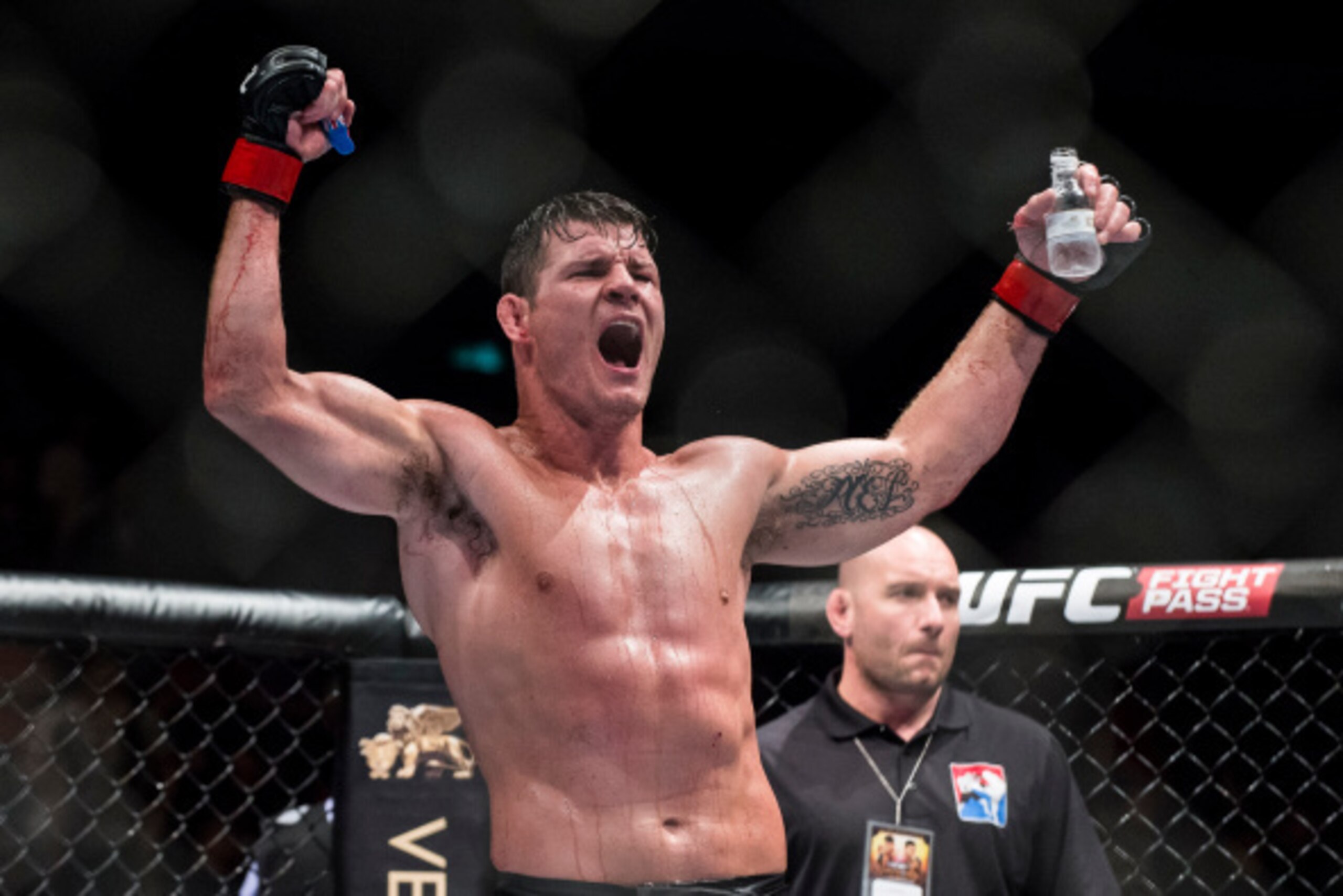 MACAU - AUGUST 23:  Michael Bisping celebrates after winning his middleweight fight against Cung Le of USA during the UFC Fight Night at The Venetian Macao Cotai Arena on August 23, 2014 in Macau, China.  (Photo by Victor Fraile/Getty Images)