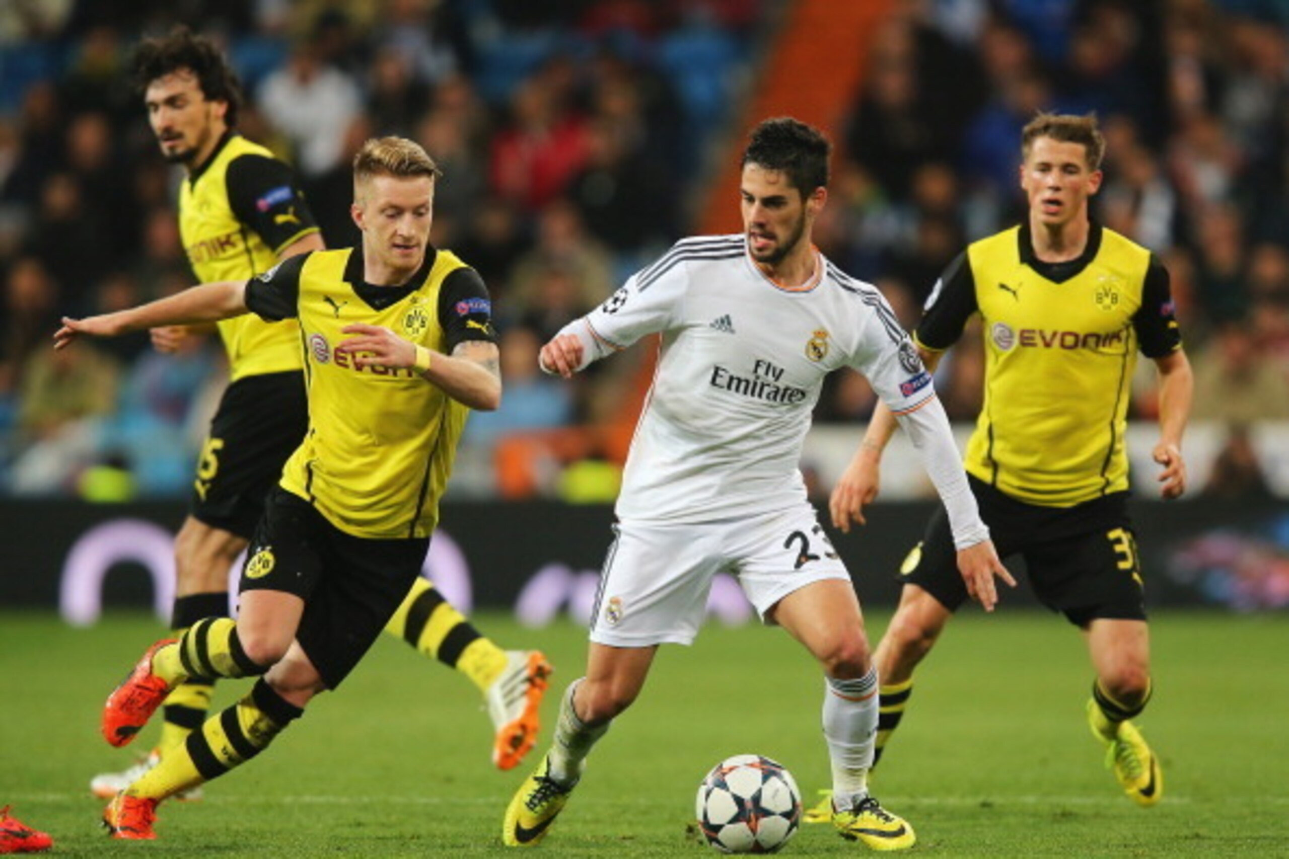 MADRID, SPAIN - APRIL 02:  Isco of Real Madrid is closed down by Marco Reus (L) of Borussia Dortmund during the UEFA Champions League Quarter Final first leg match between Real Madrid and Borussia Dortmund at Estadio Santiago Bernabeu on April 2, 2014 in 
