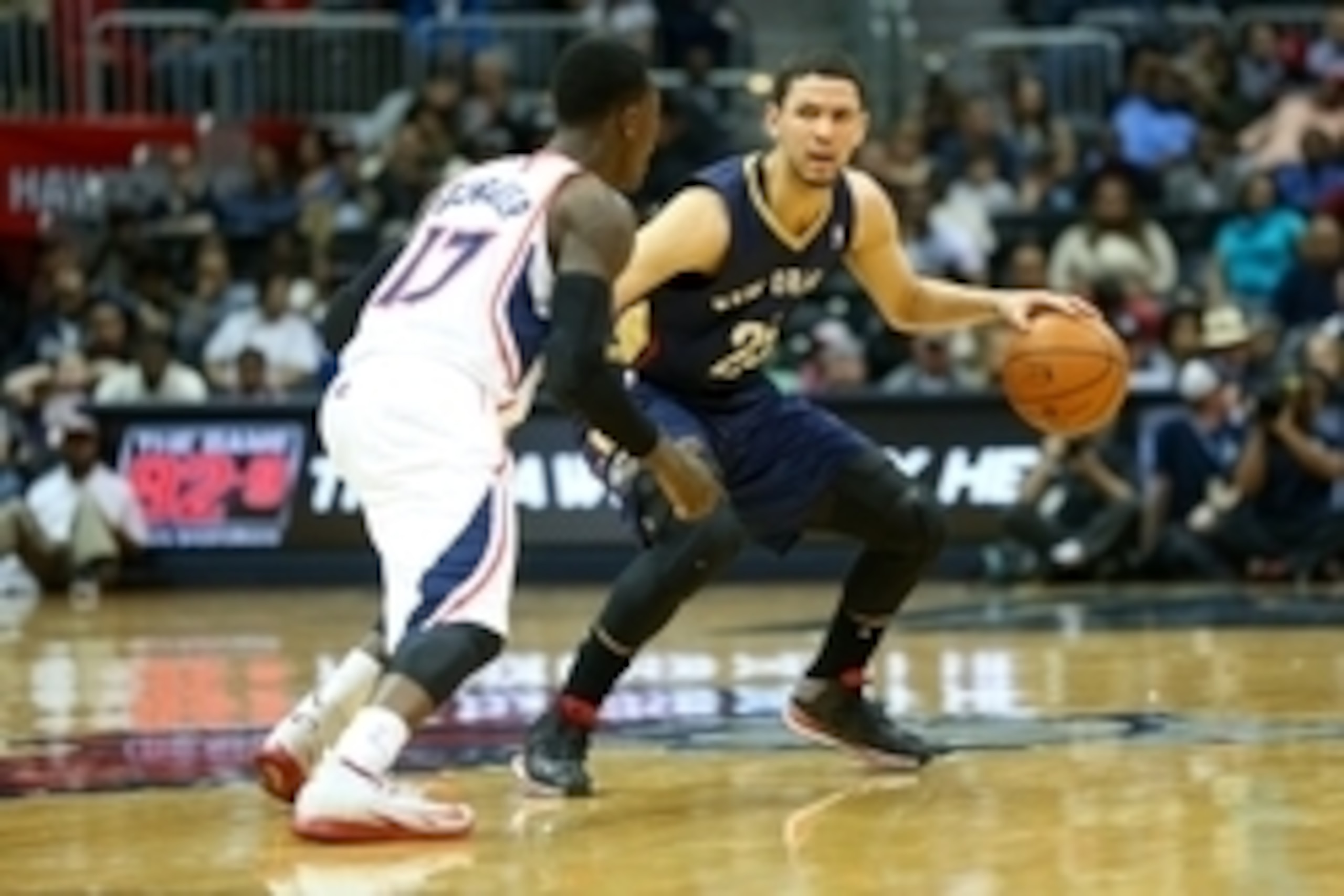 Mar 21, 2014; Atlanta, GA, USA; Atlanta Hawks guard Dennis Schroder (17) defends New Orleans Pelicans guard Austin Rivers (25) during the third quarter at Philips Arena. The Pelicans won 111-105. Mandatory Credit: Kevin Liles-USA TODAY Sports
