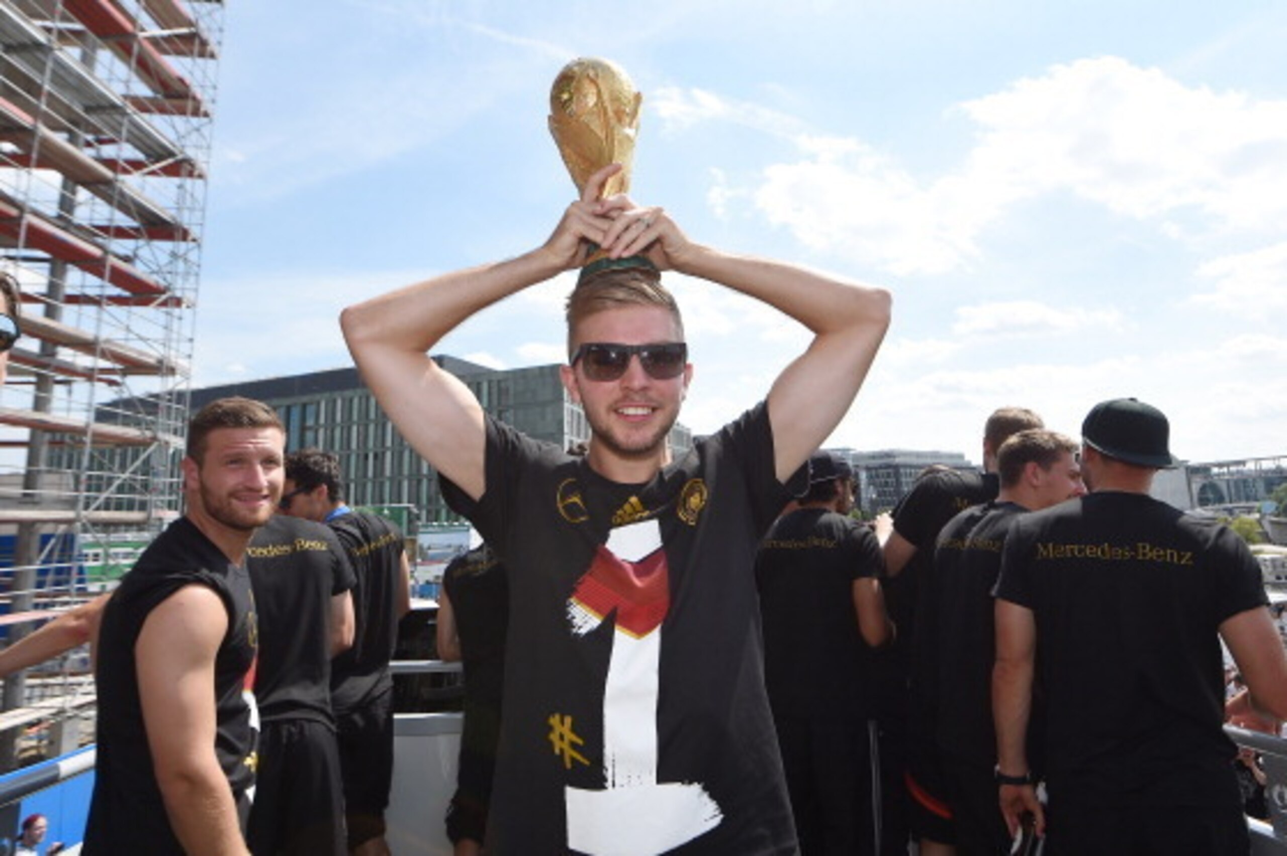 BERLIN, GERMANY - JULY 15: Christoph Kramer celebrates on stage at the German team victory ceremony on July 15, 2014 in Berlin, Germany. Germany won the 2014 FIFA World Cup Brazil match against Argentina in Rio de Janeiro on July 13.  (Photo by Markus Gil