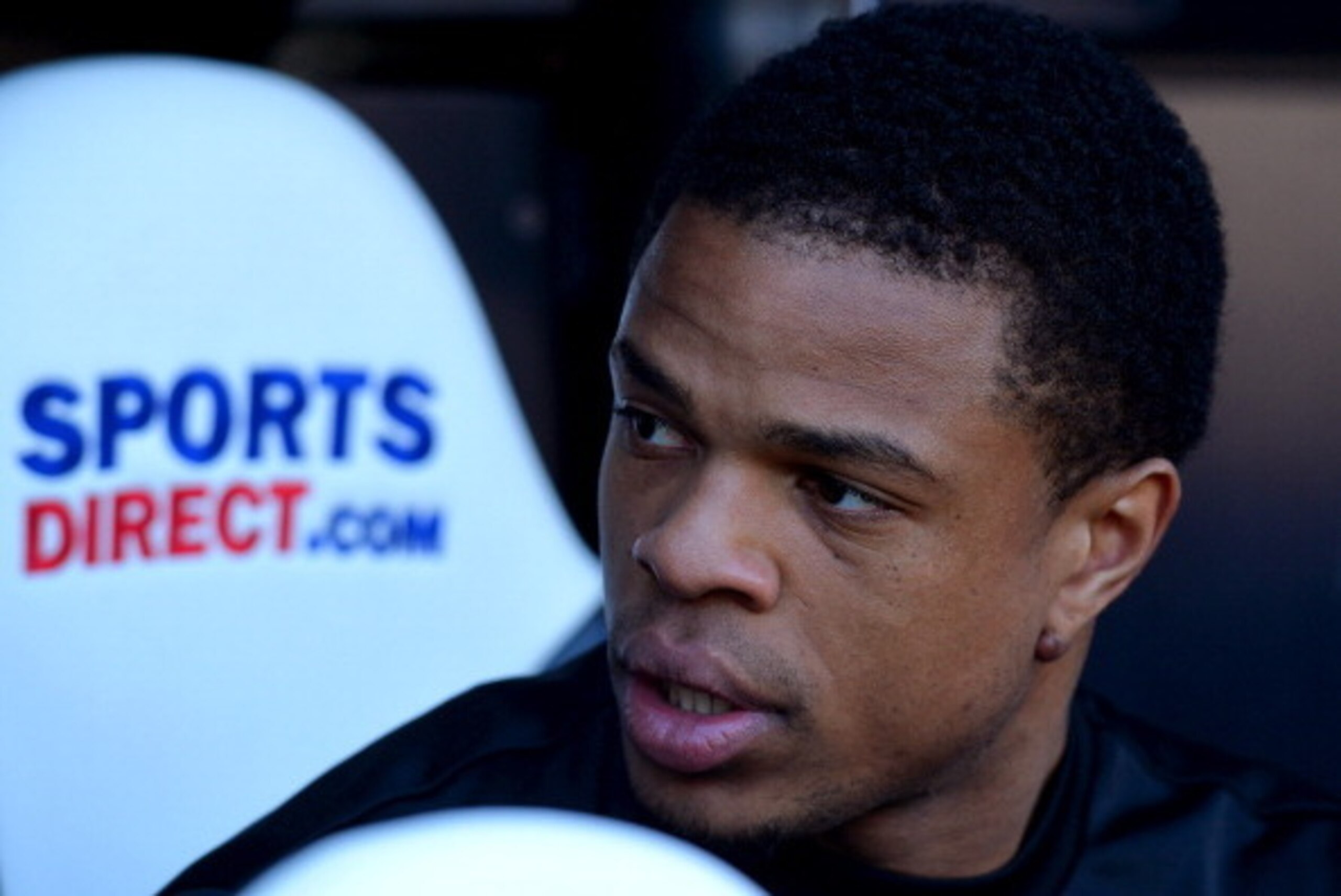 NEWCASTLE UPON TYNE, ENGLAND - APRIL 19:  Loic Remy of Newcastle United looks on from the bench during the Barclays Premier League match between Newcastle United and Swansea City at St James' Park on April 19, 2014 in Newcastle upon Tyne, England.  (Photo