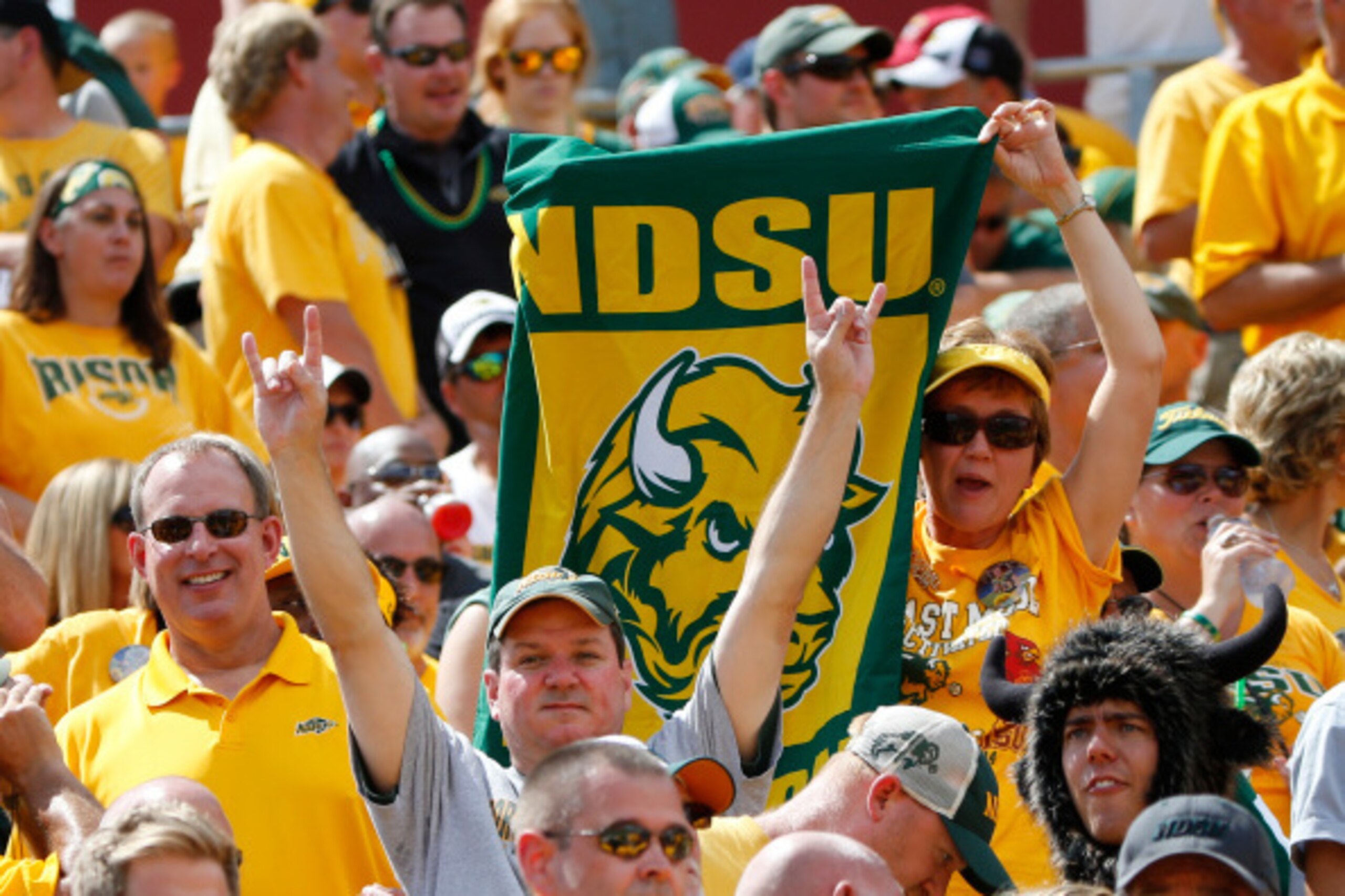 AMES, IA - AUGUST 30: North Dakota Bison fans cheer on their team in the second half of play against the Iowa State Cyclones at Jack Trice Stadium on August 30, 2014 in Ames, Iowa. North Dakota State defeated Iowa State 34-14. (Photo by David Purdy/Getty AMES, IA - AUGUST 30: North Dakota Bison fans cheer on their team in the second half of play against the Iowa State Cyclones at Jack Trice Stadium on August 30, 2014 in Ames, Iowa. North Dakota State defeated Iowa State 34-14. (Photo by David Purdy/Getty