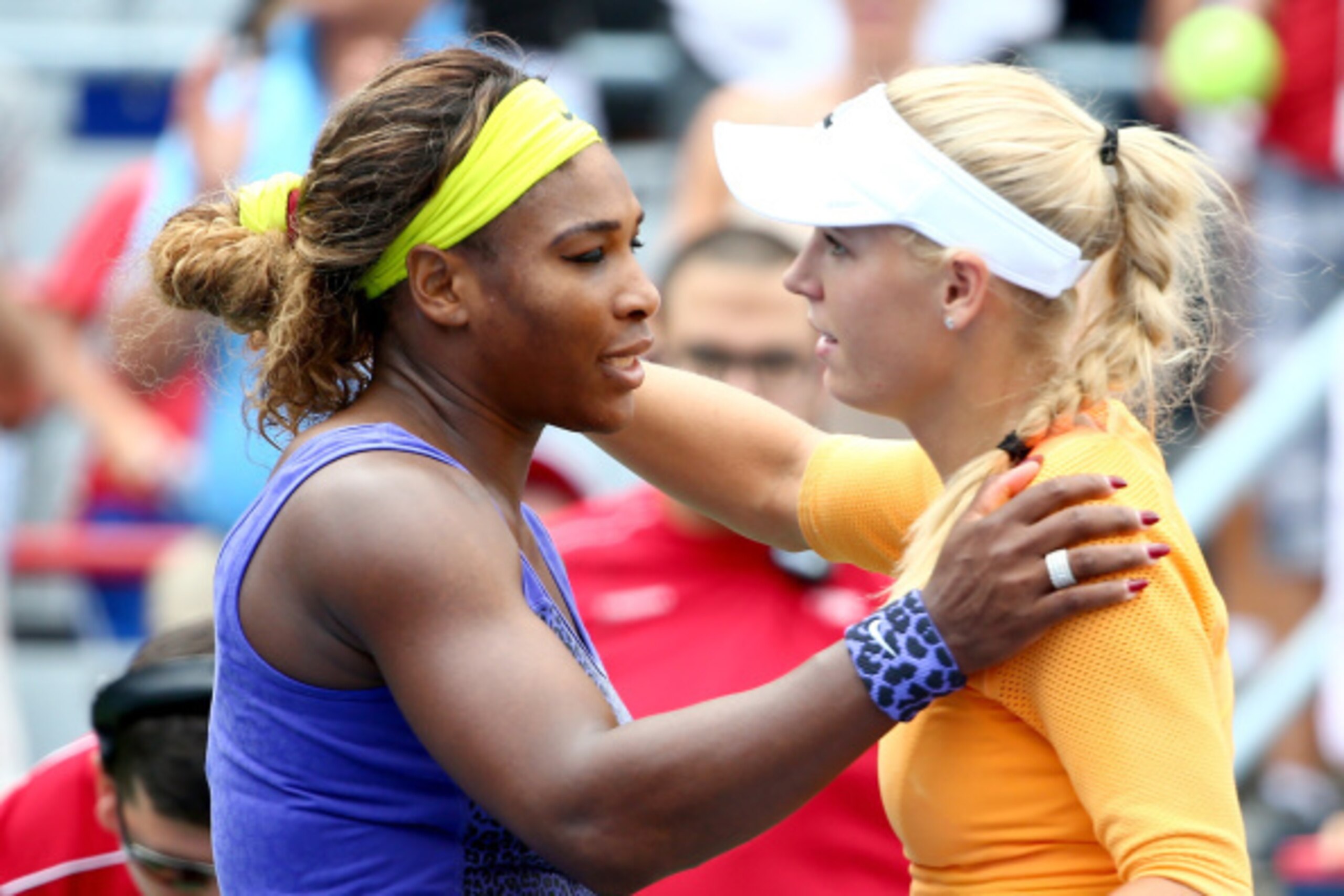 MONTREAL, QC - AUGUST 08:  (L-R)Serena Williams of the USA hugs Caroline Wozniacki of Denmark after their quarterfinal match during the Rogers Cup at Uniprix Stadium on August 8, 2014 in Montreal, Canada.  (Photo by Streeter Lecka/Getty Images)