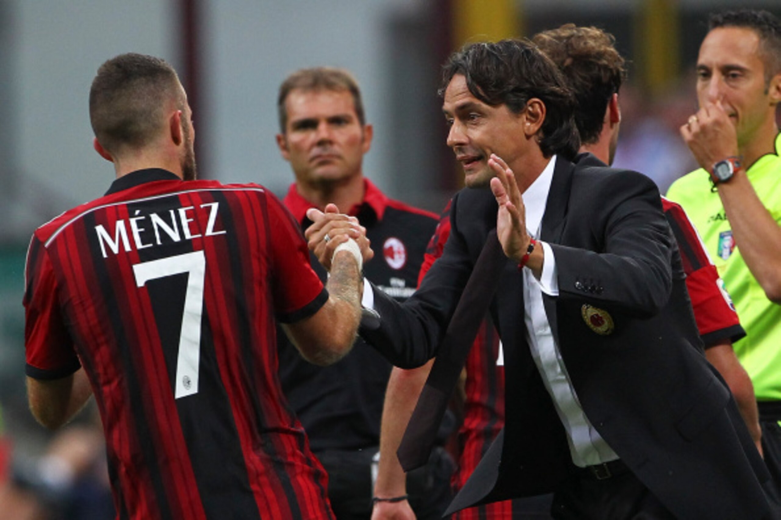 MILAN, ITALY - AUGUST 31:  Jeremy Menez of AC Milan celebrates with his coach Filippo Inzaghi after scoring his goal during the Serie A match between AC Milan and SS Lazio at Stadio Giuseppe Meazza on August 31, 2014 in Milan, Italy.  (Photo by Marco Luzz