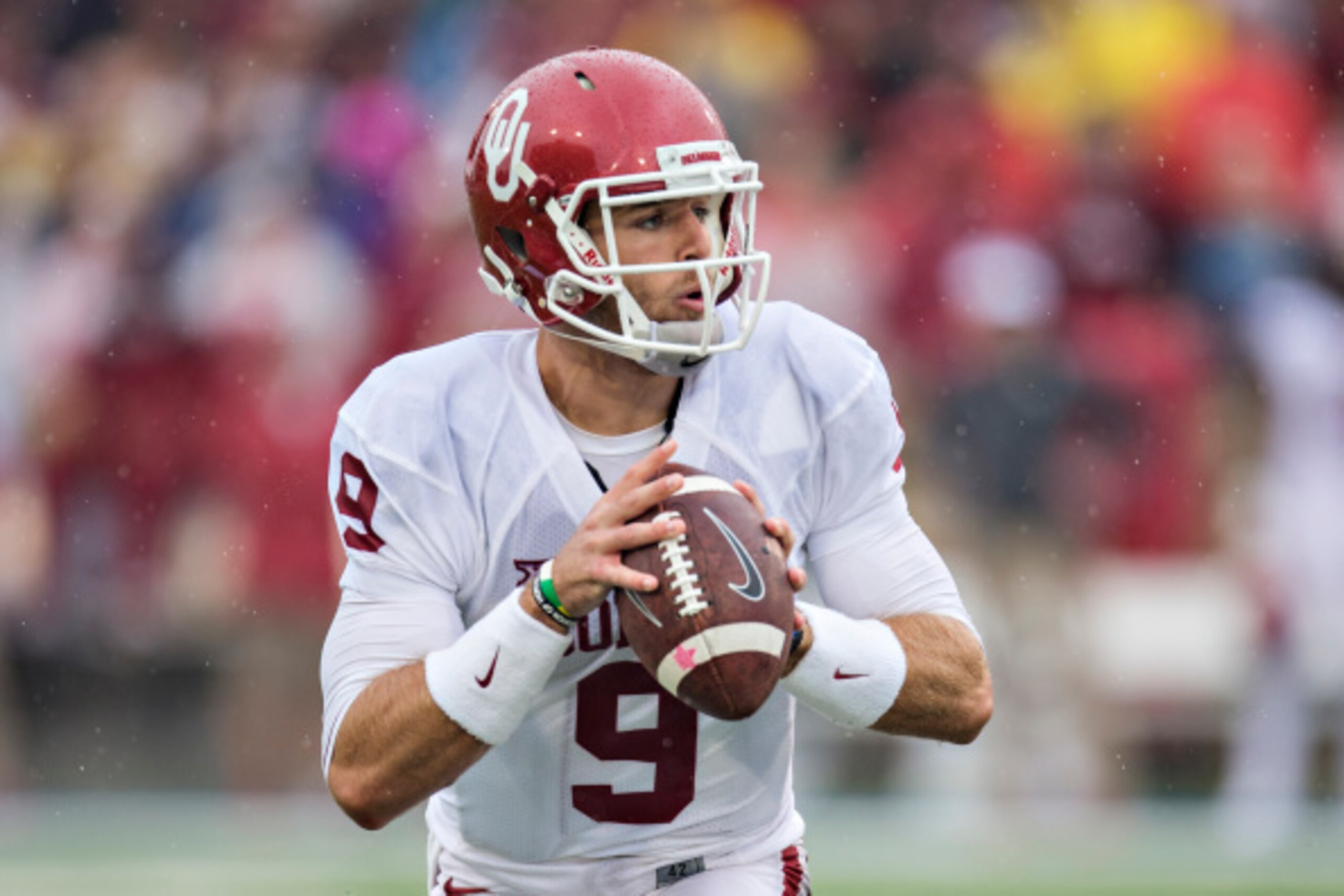 TULSA, OK - SEPTEMBER 6:  Trevor Knight #9 of the Oklahoma Sooners looks downfield for a receiver  during a game against the Tulsa Golden Hurricanes at H.A. Chapman Stadium on September 6, 2014 in Tulsa, Oklahoma.  (Photo by Wesley Hitt/Getty Images)