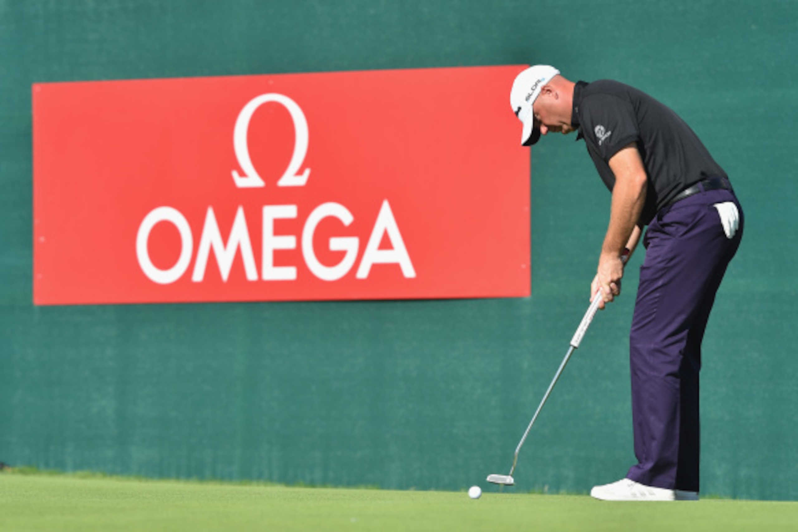 CRANS-MONTANA, SWITZERLAND - SEPTEMBER 06:  Graeme Storm of England putts on the 18th hole during the third round of the Omega European Masters at Crans-sur-Sierre Golf Club on September 6, 2014 in Crans-Montana, Switzerland.  (Photo by Stuart Franklin/Ge