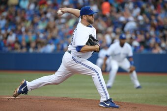 TORONTO, CANADA - AUGUST 29: Mark Buehrle #56 of the Toronto Blue Jays delivers a pitch in the first inning during MLB game action against the New York Yankees on August 29, 2014 at Rogers Centre in Toronto, Ontario, Canada. (Photo by Tom Szczerbowski/Get