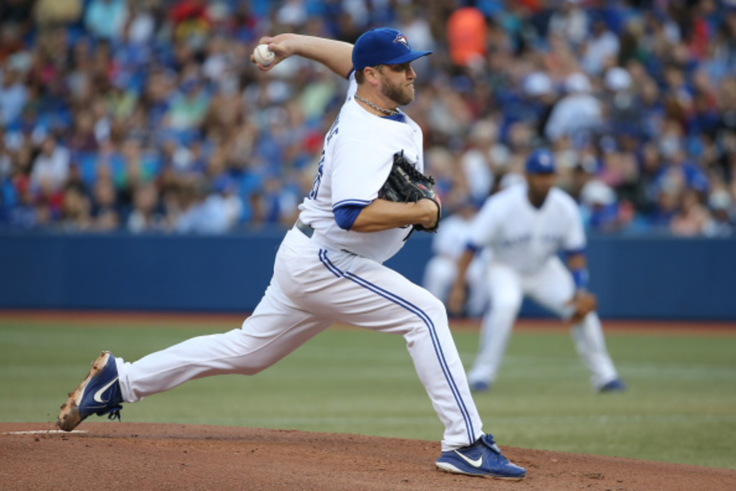 TORONTO, CANADA - AUGUST 29: Mark Buehrle #56 of the Toronto Blue Jays delivers a pitch in the first inning during MLB game action against the New York Yankees on August 29, 2014 at Rogers Centre in Toronto, Ontario, Canada. (Photo by Tom Szczerbowski/Get