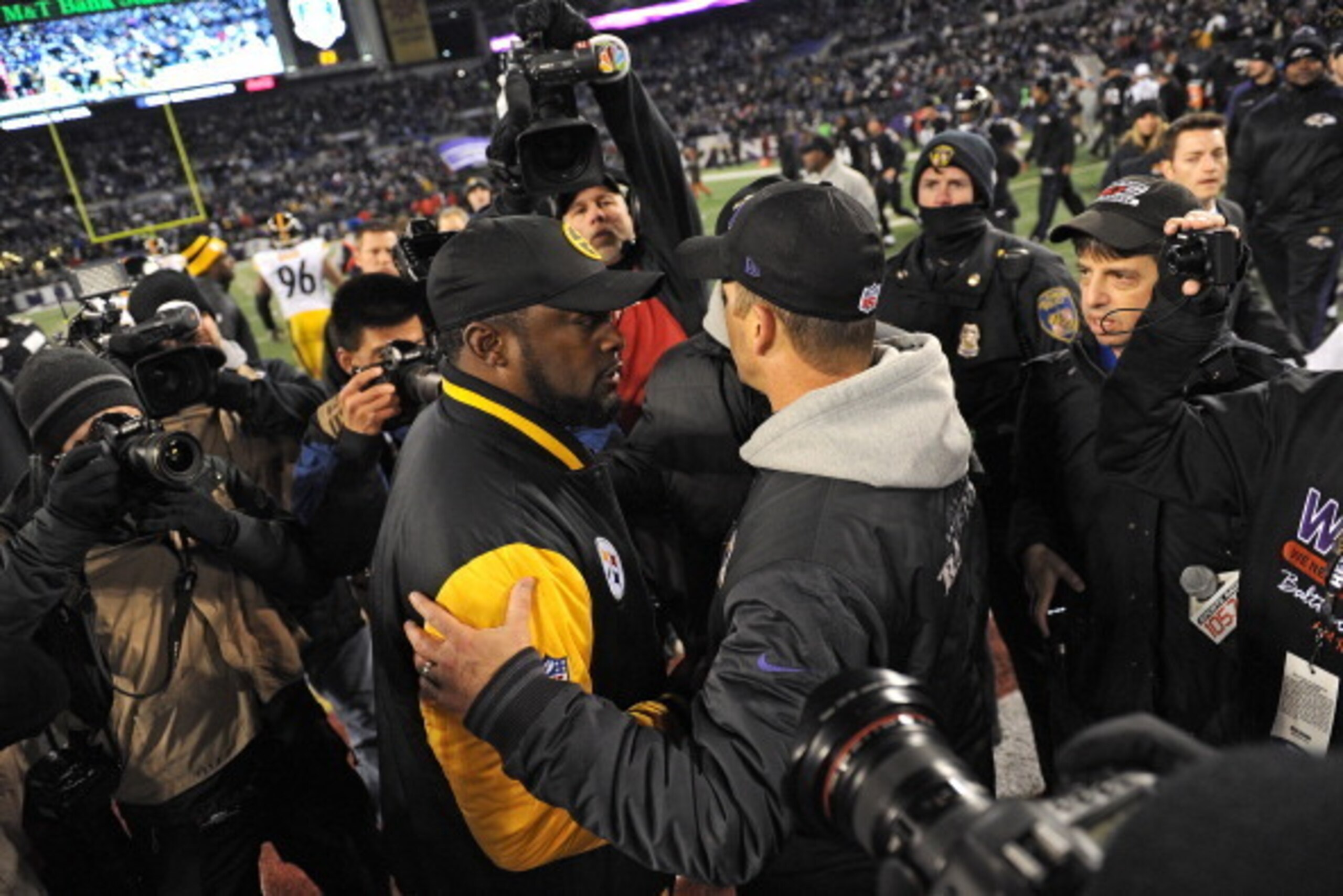 BALTIMORE, MD - NOVEMBER 28: Coach John Harbaugh of the Baltimore Ravens and coach Mike Tomlin of the Pittsburgh Steelers shake hands after an NFL game at M&T Bank Stadium on November 28, 2013 in Baltimore, Maryland. The Baltimore Ravens won, 22-20. (Phot