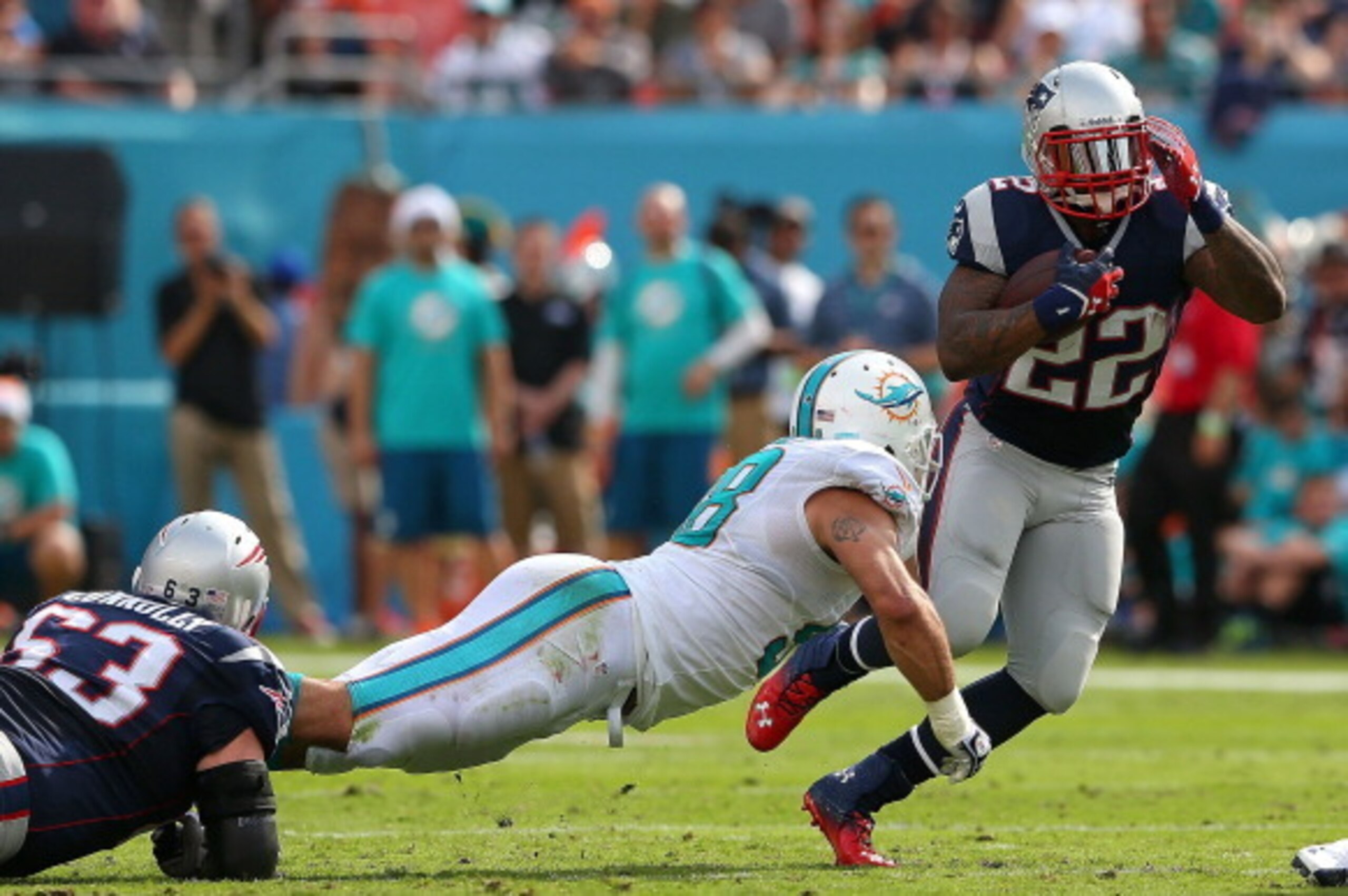 MIAMI GARDENS, FL - DECEMBER 15: Stevan Ridley #22 of the New England Patriots rushes during a game against the Miami Dolphins at Sun Life Stadium on December 15, 2013 in Miami Gardens, Florida.  (Photo by Mike Ehrmann/Getty Images)
