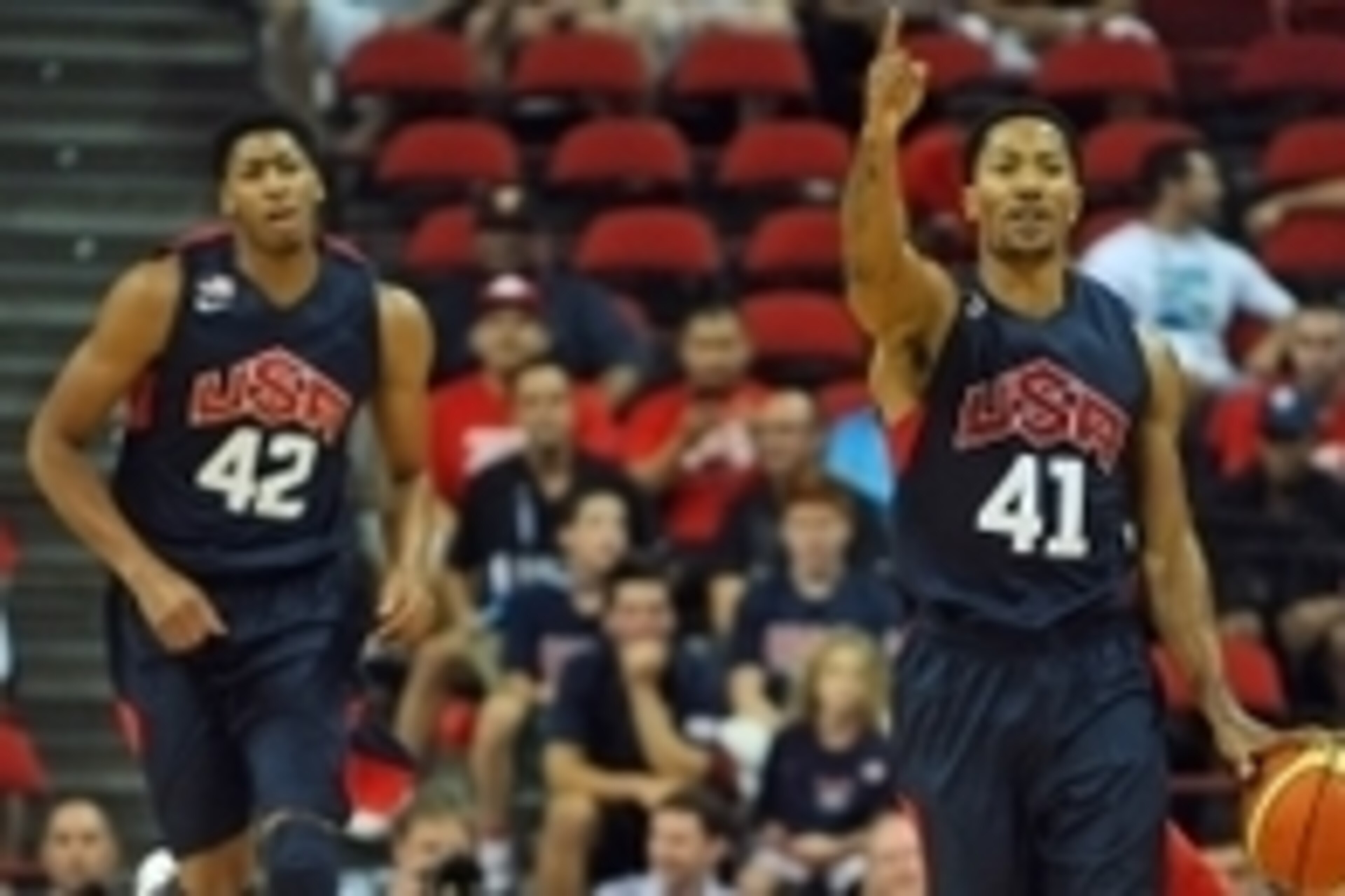 Aug 1, 2014; Las Vegas, NV, USA; USA Team Blue Derrick Rose (41) calls a play while dribbling the ball during the USA Basketball Showcase atThomas & Mack Center. Trailing the play is center Anthony Davis (42). Mandatory Credit: Stephen R. Sylvanie-USA TOD