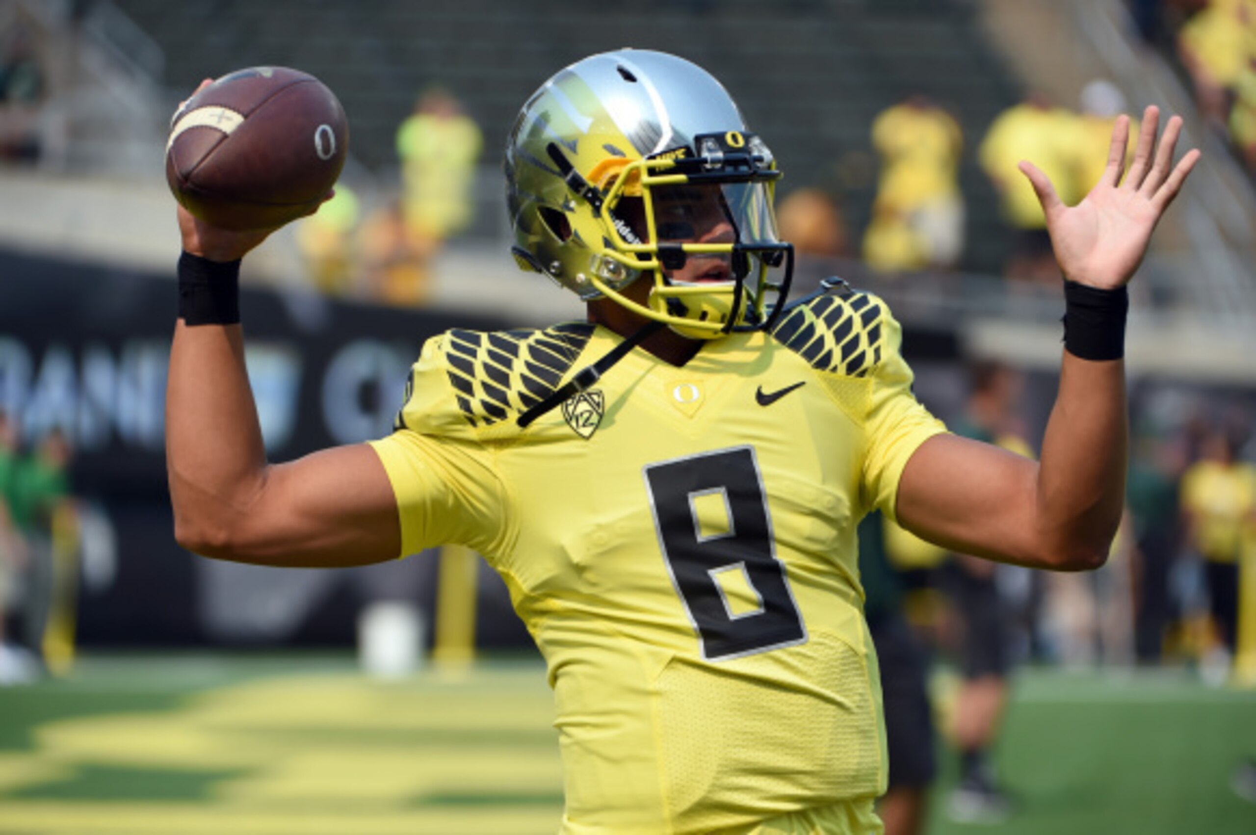 EUGENE, OR -SEPTEMBER 06: Quarterback Marcus Mariota #8 of the Oregon Ducks warms up before the game against the Michigan State Spartans at Autzen Stadium on September 6, 2014 in Eugene, Oregon. (Photo by Steve Dykes/Getty Images) EUGENE, OR -SEPTEMBER 06: Quarterback Marcus Mariota #8 of the Oregon Ducks warms up before the game against the Michigan State Spartans at Autzen Stadium on September 6, 2014 in Eugene, Oregon. (Photo by Steve Dykes/Getty Images)