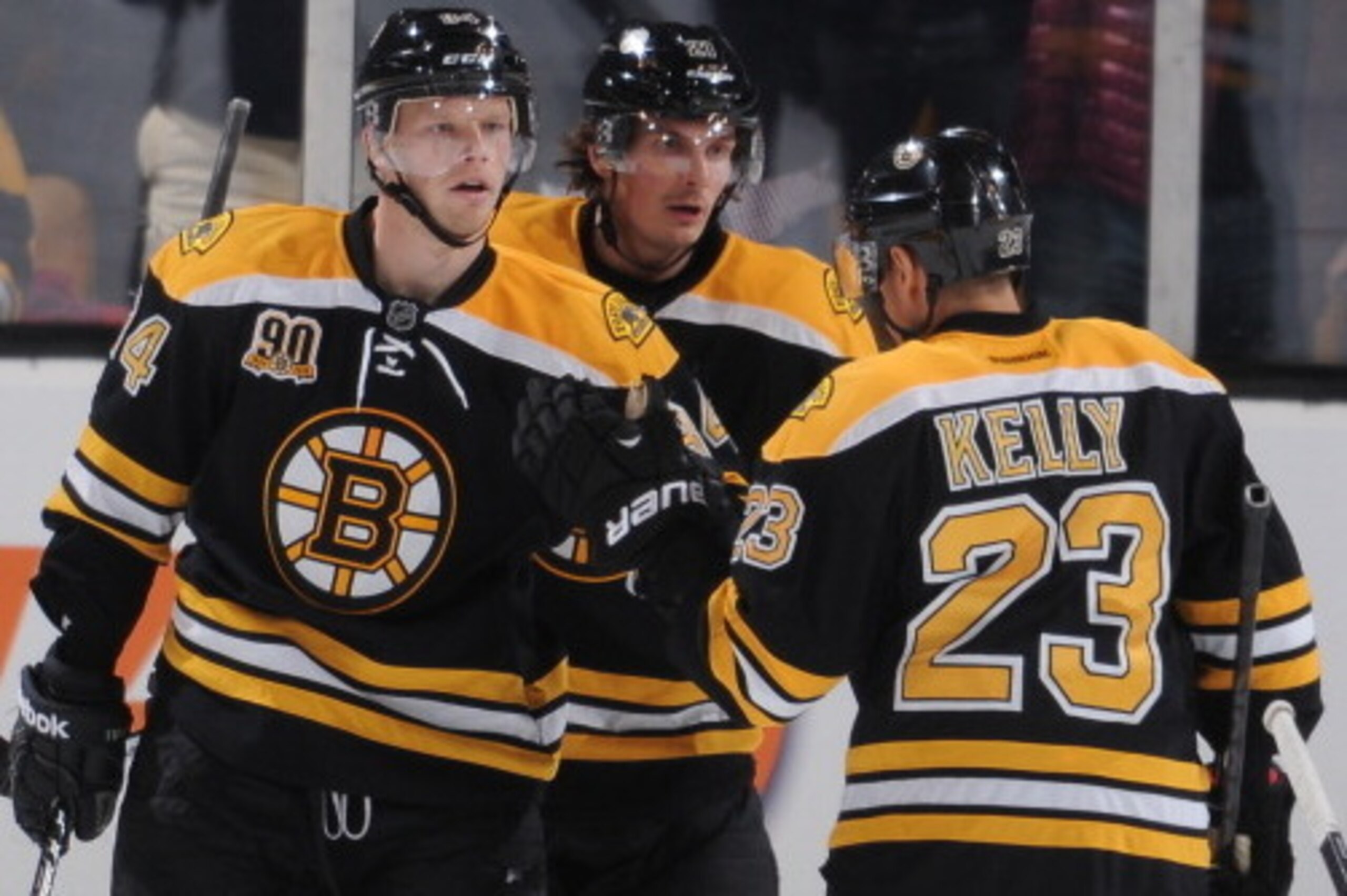 BOSTON, MA - MARCH 27: Carl Soderberg #34, Loui Eriksson #23 and Chris Kelly #23 of the Boston Bruins celebrate a goal against the Chicago Blackhawks at the TD Garden on March 27, 2014 in Boston, Massachusetts.  (Photo by Steve Babineau/NHLI via Getty Ima