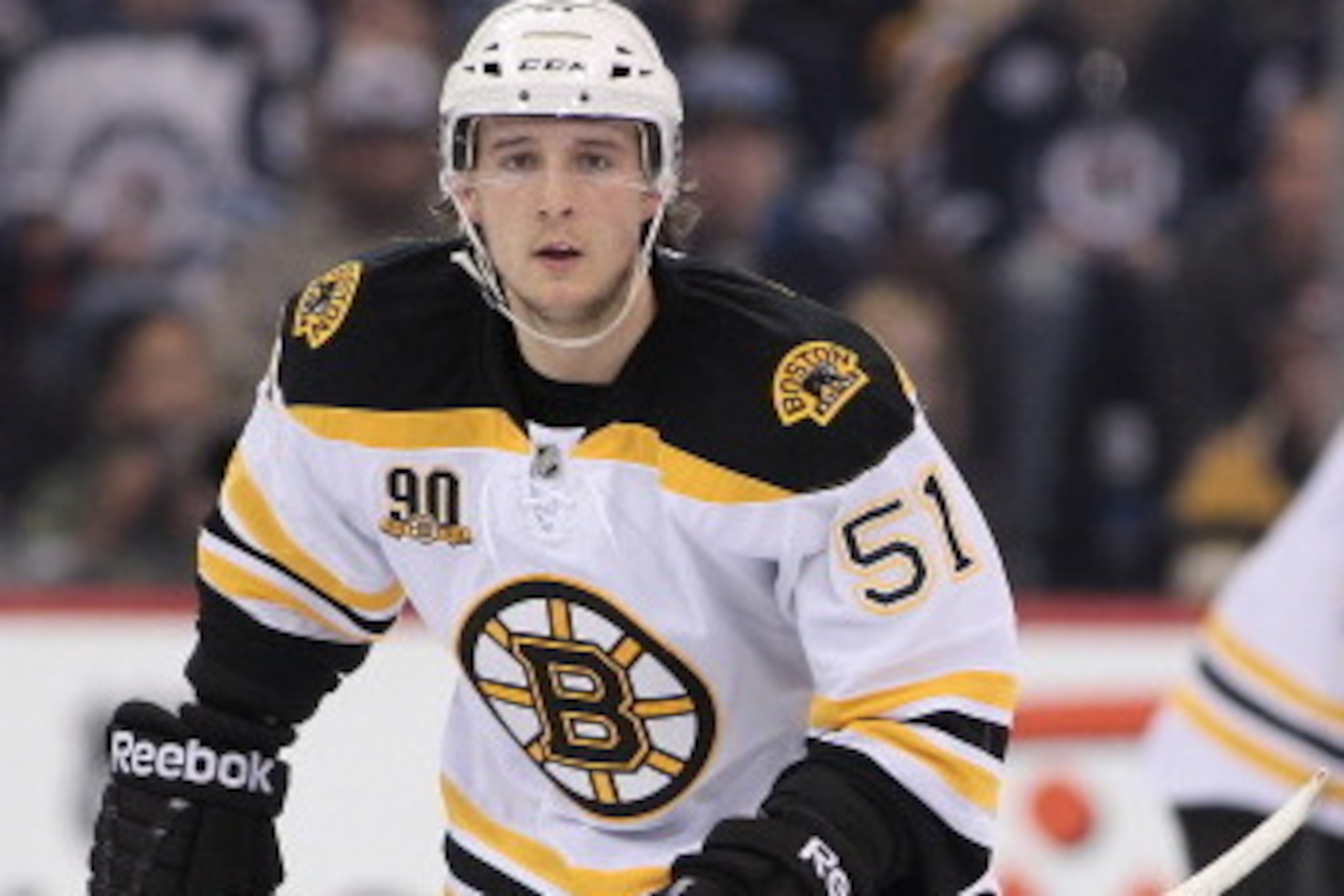 WINNIPEG, MB - APRIL 10: Ryan Spooner #51 of the Boston Bruins skates down the ice during the second period of the NHL game against the Winnipeg Jets at the MTS Centre on April 10, 2014 in Winnipeg, Manitoba, Canada. (Photo by Marianne Helm/Getty Images)