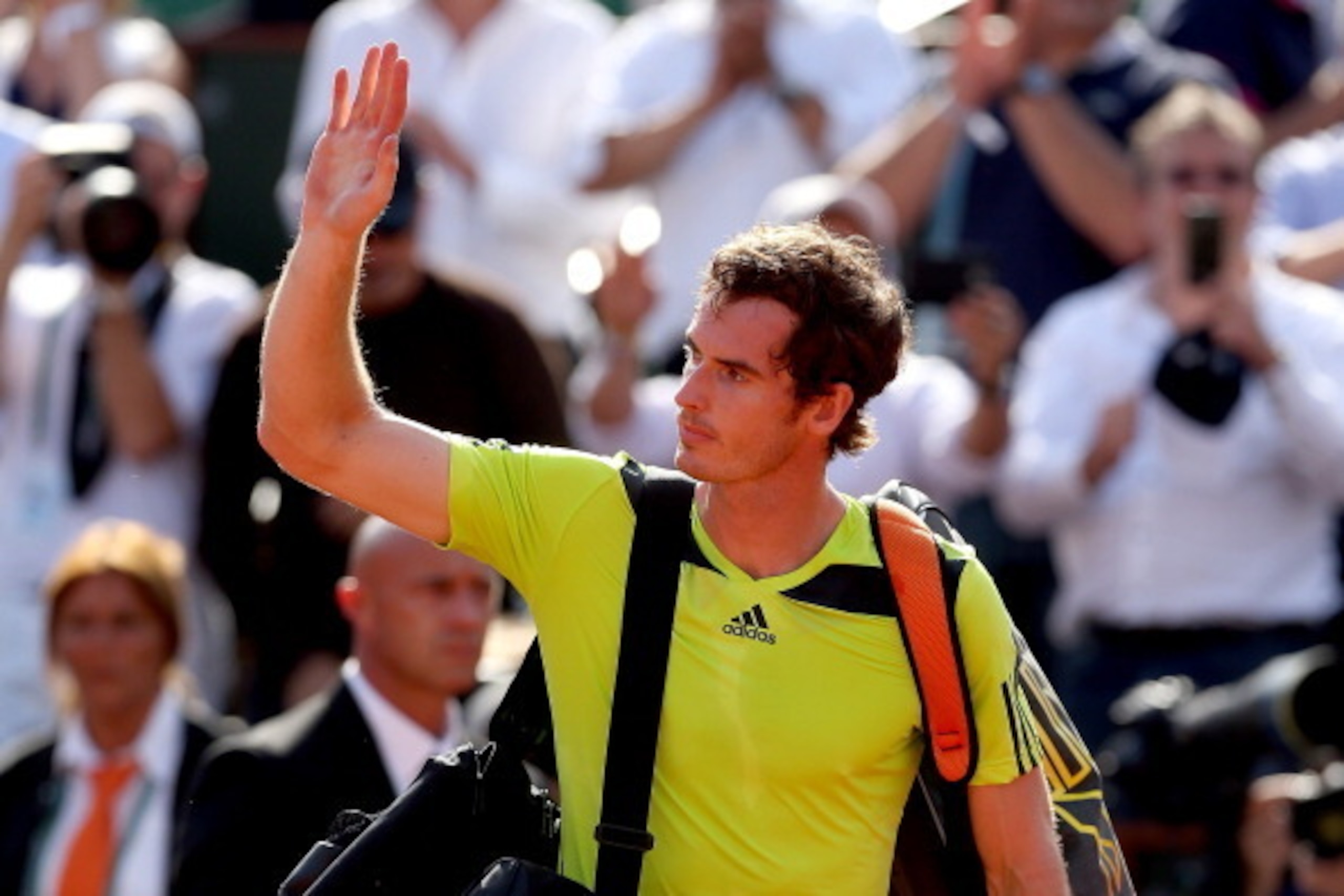 PARIS, FRANCE - JUNE 06:  Andy Murray of Great Britain waves to the crowd as he leaves the court following his defeat in his men's singles match against Rafael Nadal of Spain on day thirteen of the French Open at Roland Garros on June 6, 2014 in Paris, Fr