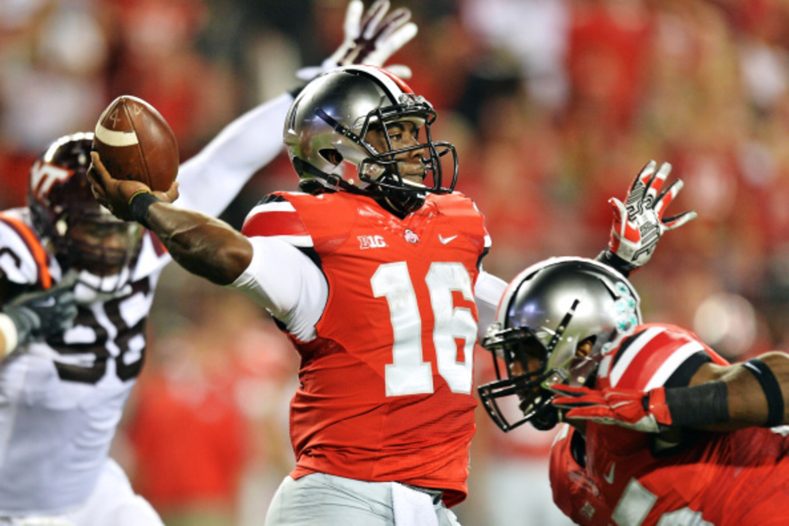 COLUMBUS, OH - SEPTEMBER 6:  Quarterback J.T. Barrett #16 of the Ohio State Buckeyes passes against the Virginia Tech Hokies in the second quarter at Ohio Stadium on September 6, 2014 in Columbus, Ohio.  (Photo by Jamie Sabau/Getty Images)