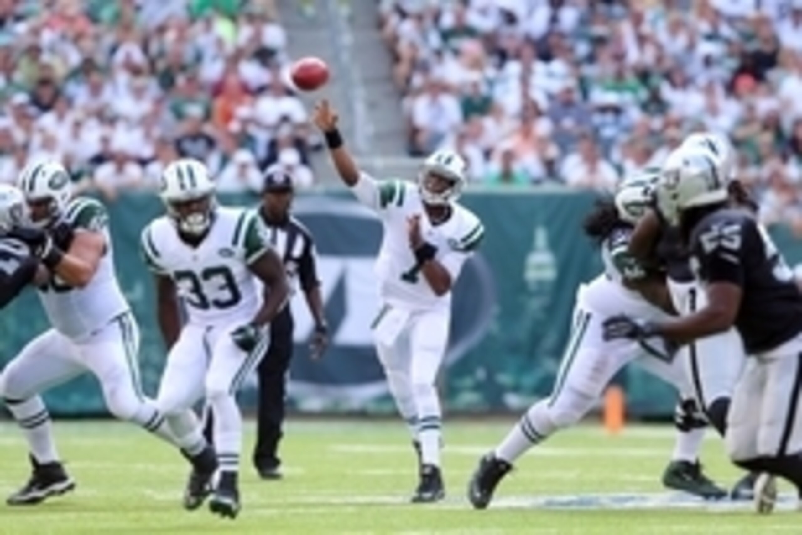 Sep 7, 2014; East Rutherford, NJ, USA; New York Jets quarterback Geno Smith (7) drops back to pass against the Oakland Raiders during the second quarter of a game at MetLife Stadium. Mandatory Credit: Brad Penner-USA TODAY Sports Sep 7, 2014; East Rutherford, NJ, USA; New York Jets quarterback Geno Smith (7) drops back to pass against the Oakland Raiders during the second quarter of a game at MetLife Stadium. Mandatory Credit: Brad Penner-USA TODAY Sports