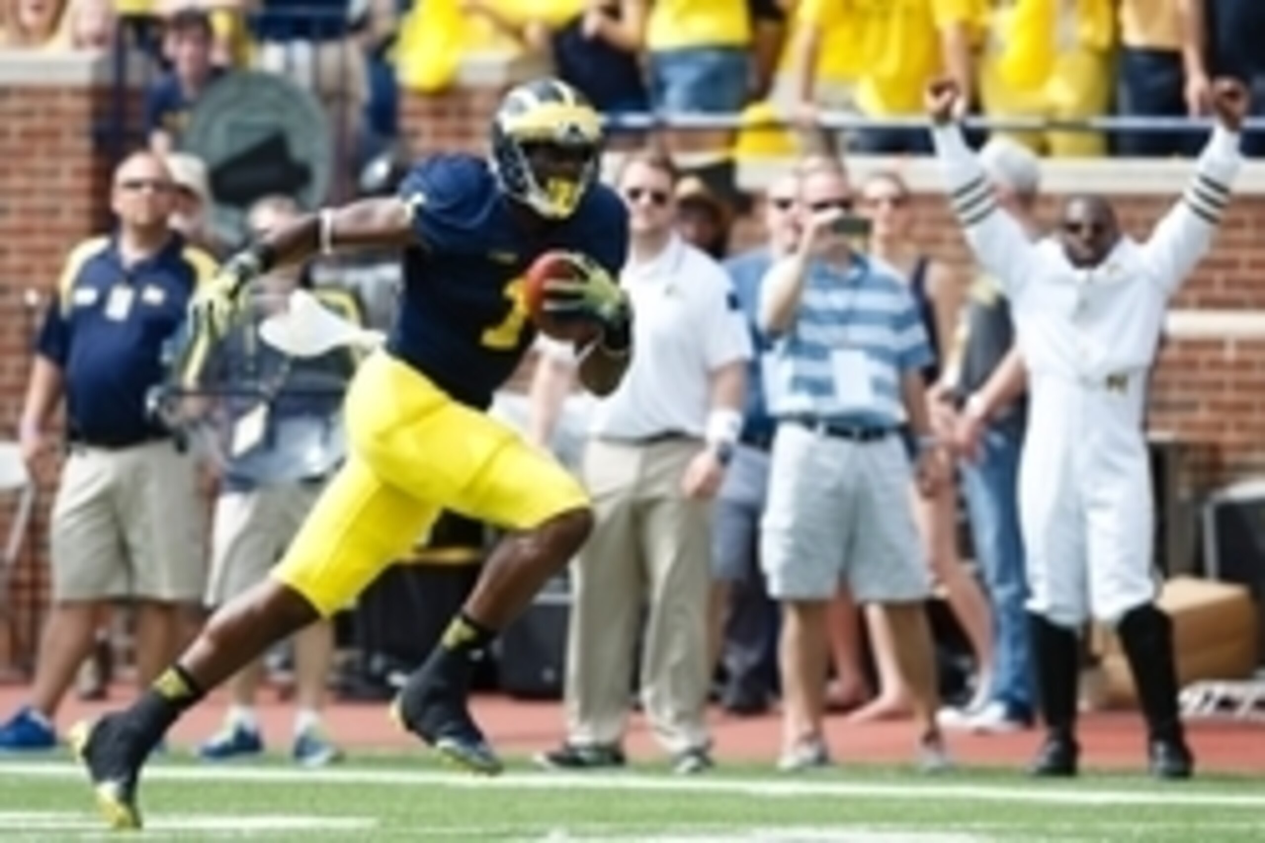 Aug 30, 2014; Ann Arbor, MI, USA; Michigan Wolverines wide receiver Devin Funchess (1) runs the ball for a touchdown in the first quarter against the Appalachian State Mountaineers at Michigan Stadium. Mandatory Credit: Rick Osentoski-USA TODAY Sports Aug 30, 2014; Ann Arbor, MI, USA; Michigan Wolverines wide receiver Devin Funchess (1) runs the ball for a touchdown in the first quarter against the Appalachian State Mountaineers at Michigan Stadium. Mandatory Credit: Rick Osentoski-USA TODAY Sports