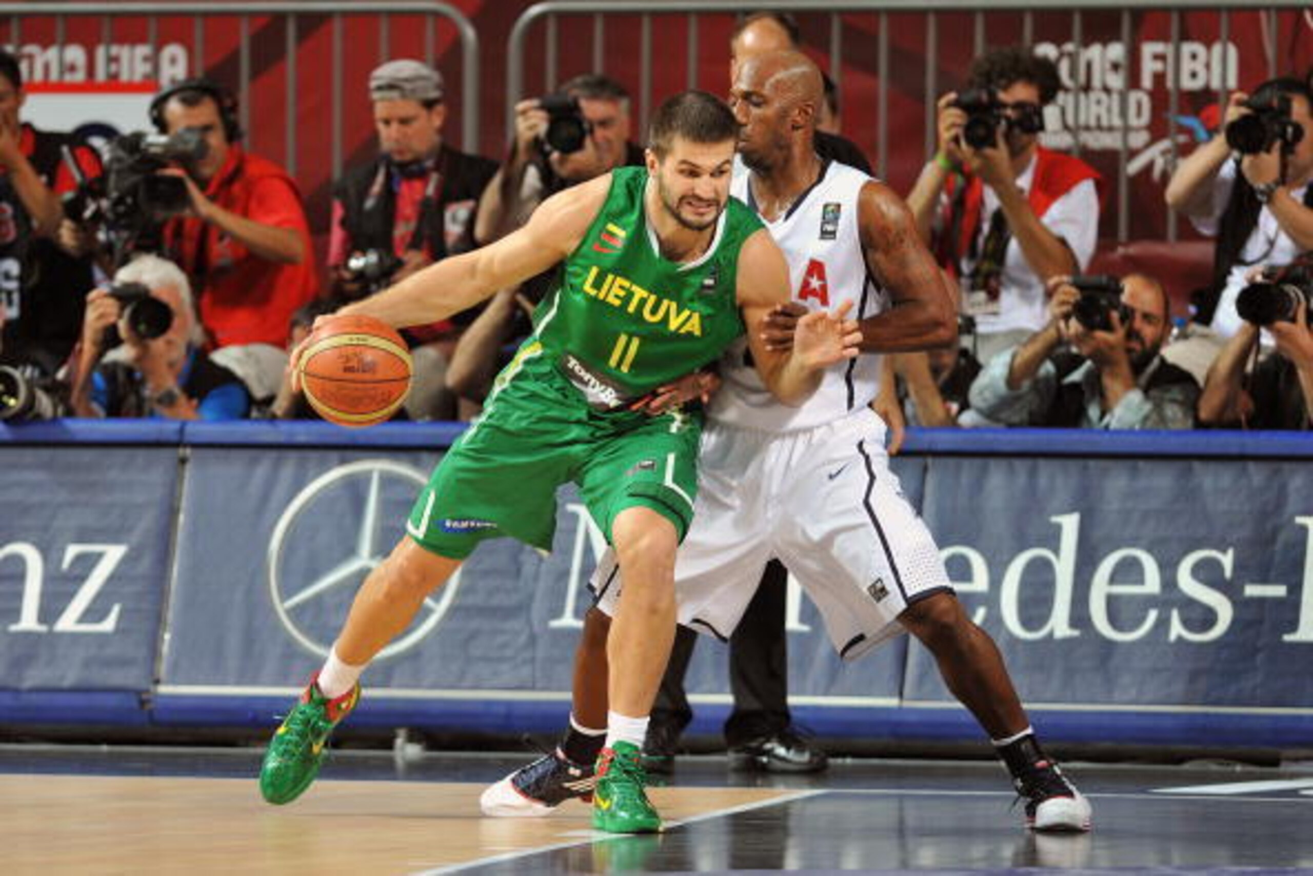 ISTANBUL, TURKEY - SEPTEMBER 11: Linas Kleiza #11 of Lithuania drives to the basket against Chauncey Billups #4 of the USA Senior Men's National Team during the 2010 World Championships of Basketball on September 11, 2010 at the Sinan Erdem Dome in Istanb