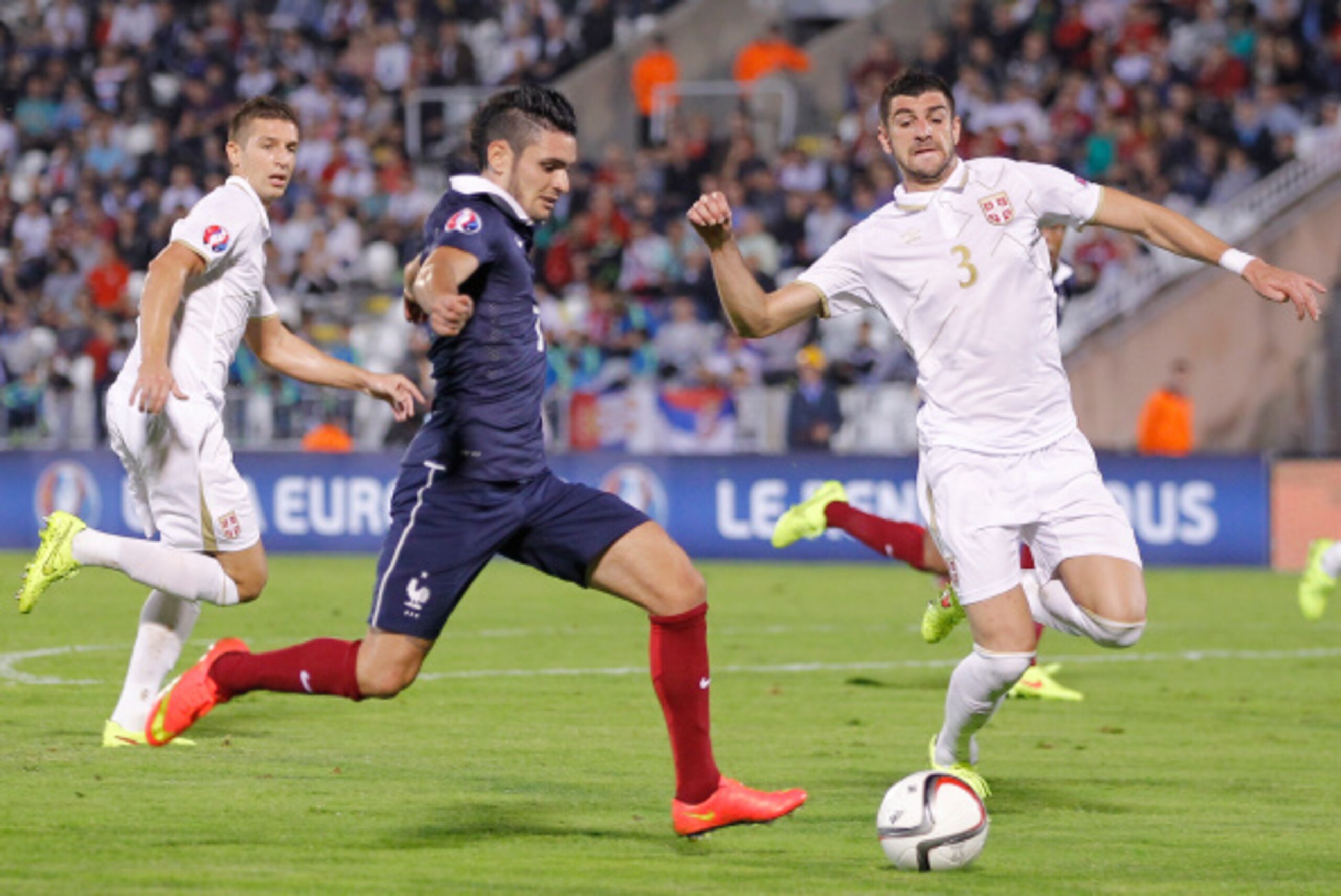 BELGRADE, SERBIA - SEPTEMBER 07: Remy Cabella (L) of France in action against Stefan Mitrovic (R) of Serbia during the International friendly match between Serbia and France at the Stadium JNA on September 07, 2014 in Belgrade, Serbia, 2014. (Photo by Srd