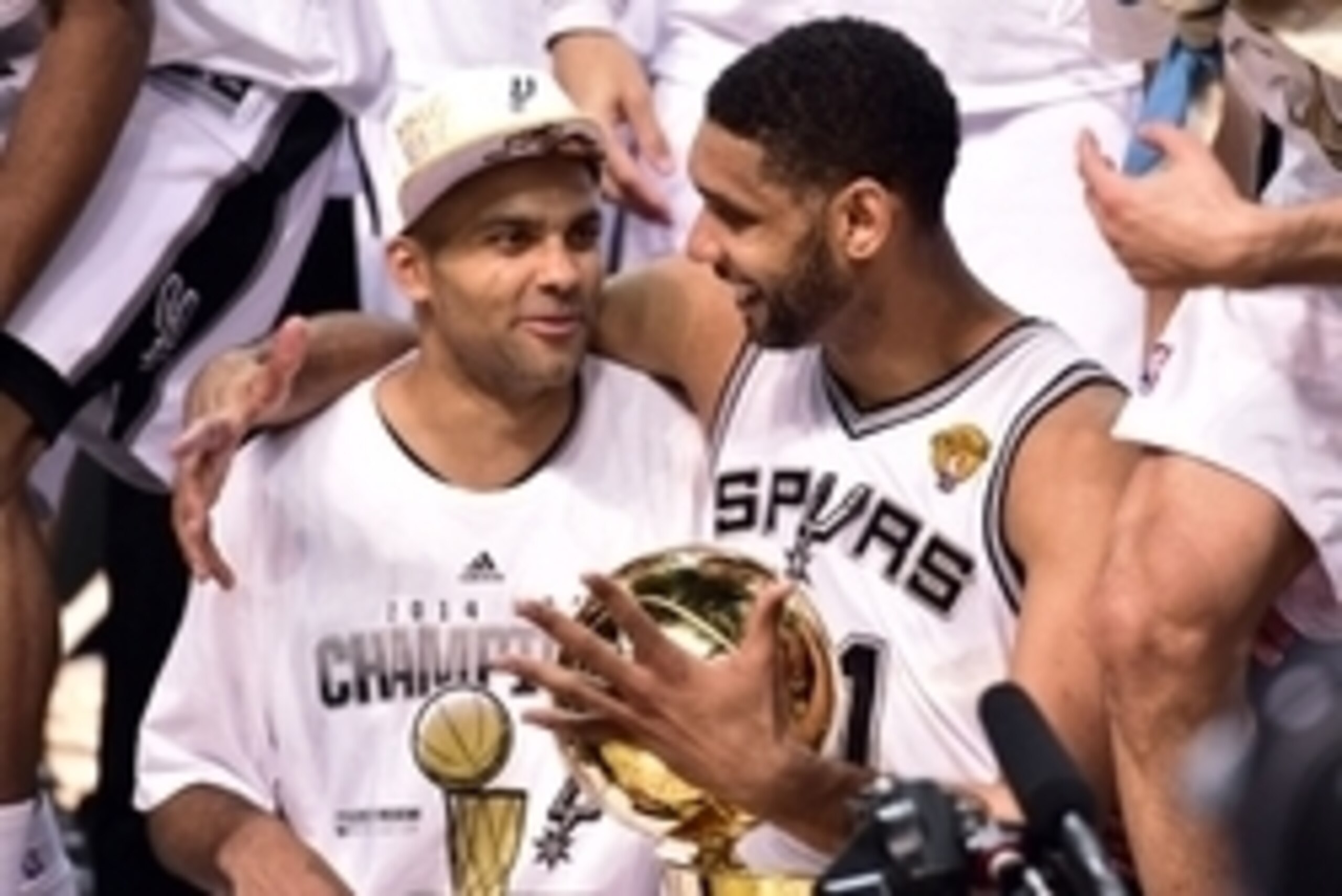 Jun 15, 2014; San Antonio, TX, USA; San Antonio Spurs guard Tony Parker (9) and San Antonio Spurs forward Tim Duncan (21) celebrates after game five of the 2014 NBA Finals at AT&T Center. The Spurs beat the Heat 104-87 to win the NBA Finals. Mandatory Cre