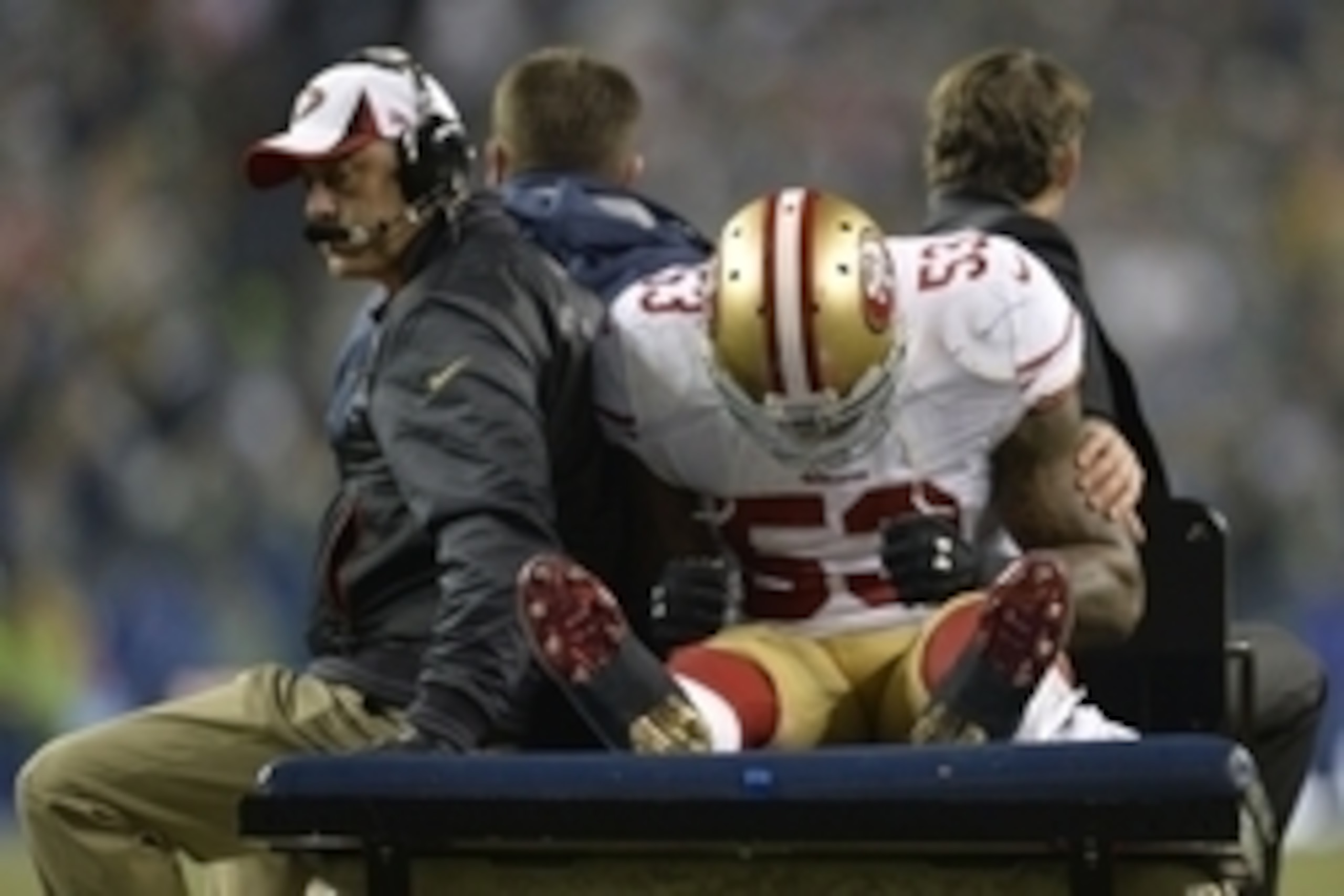 Jan 19, 2014; Seattle, WA, USA; San Francisco 49ers inside linebacker NaVorro Bowman (53) is carted off the field during the second half of the 2013 NFC Championship football game against the Seattle Seahawks at CenturyLink Field. The Seahawks defeated th