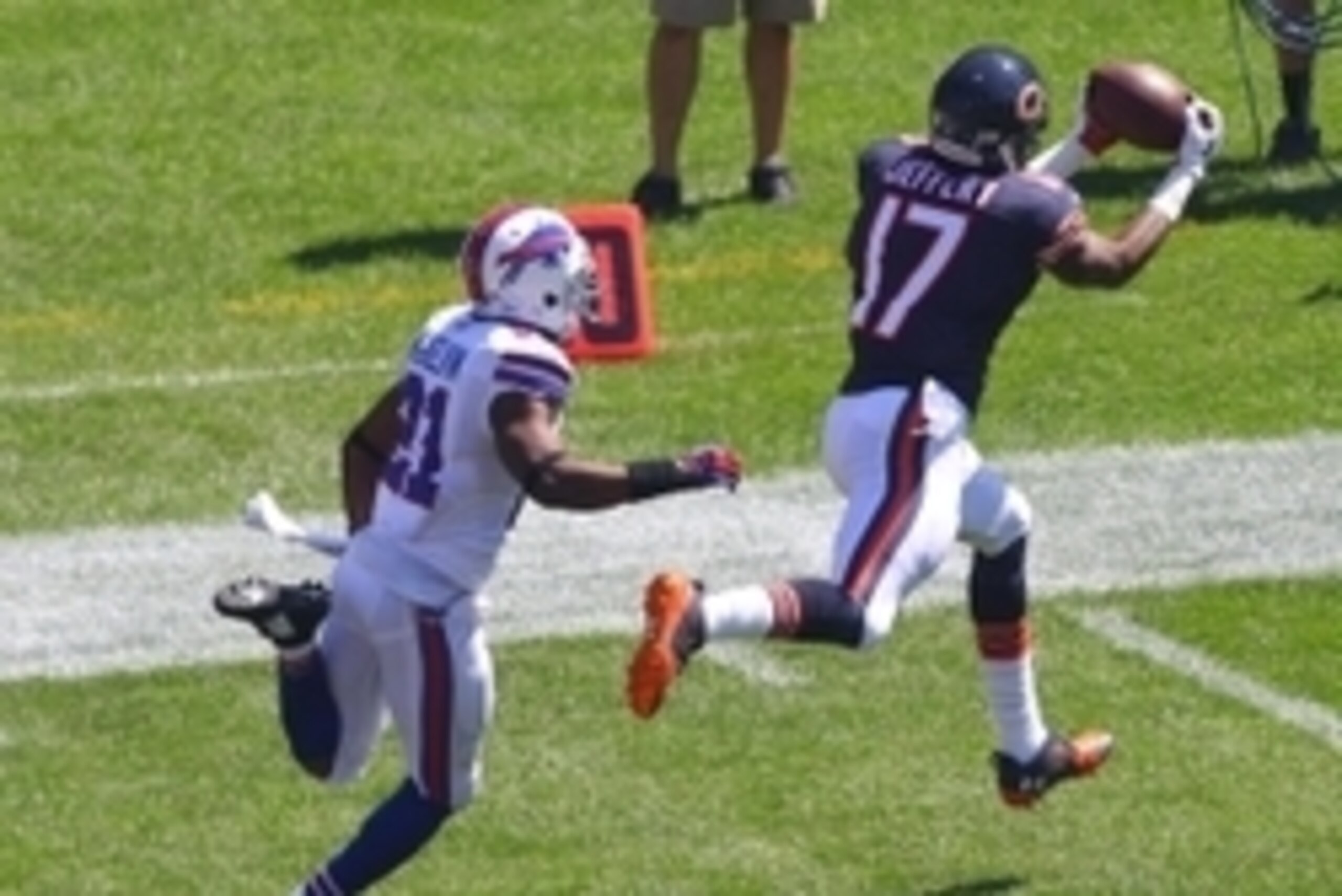 Sep 7, 2014; Chicago, IL, USA; Chicago Bears wide receiver Alshon Jeffery (17) catches a 44 yard pass from quarterback Jay Cutler (not pictured) with Buffalo Bills cornerback Leodis McKelvin (21) defending during the first quarter at Soldier Field. Mandat