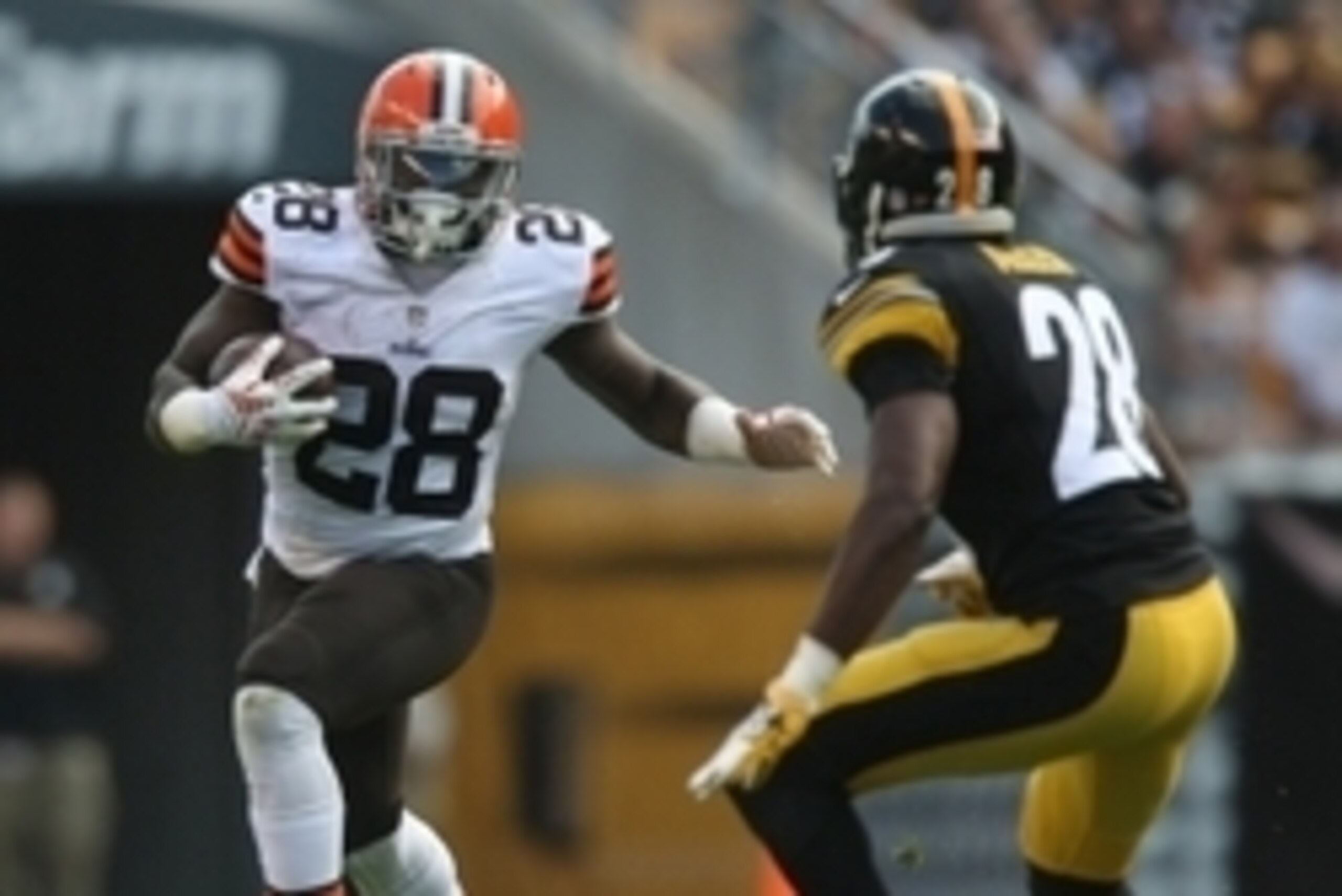 Sep 7, 2014; Pittsburgh, PA, USA; Cleveland Browns running back Terrance West (28) runs the ball against Pittsburgh Steelers cornerback Cortez Allen (28) during the second half at Heinz Field. Pittsburgh won the game, 30-27. Mandatory Credit: Jason Bridge