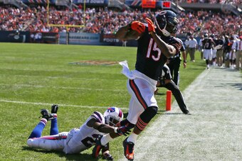 CHICAGO, IL - SEPTEMBER 07:  Brandon Marshall #15 of the Chicago Bears slips by Leodis McKelvin #21 of the Buffalo Bills to score a third quarter touchdown at Soldier Field on September 7, 2014 in Chicago, Illinois. (Photo by Jonathan Daniel/Getty Images)