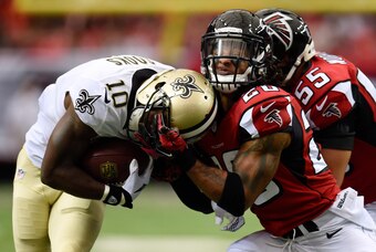 Sep 7, 2014; Atlanta, GA, USA; New Orleans Saints wide receiver Brandin Cooks (10) is tackled by Atlanta Falcons free safety Dwight Lowery (20) during the first quarter at the Georgia Dome. Mandatory Credit: Dale Zanine-USA TODAY Sports