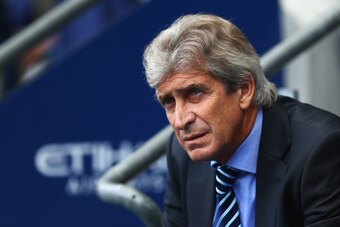 MANCHESTER, ENGLAND - AUGUST 30:  Manuel Pellegrini, manager of Manchester City looks on prior to the Barclays Premier League match between Manchester City and Stoke City at Etihad Stadium on August 30, 2014 in Manchester, England.  (Photo by Clive Mason/