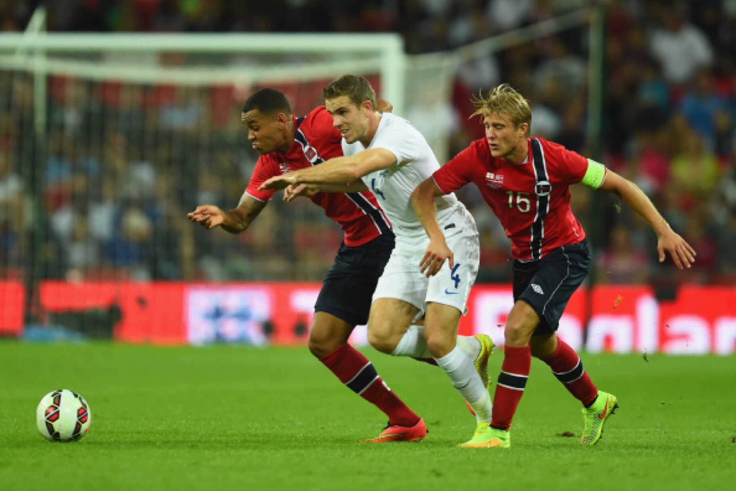 LONDON, ENGLAND - SEPTEMBER 03:  Jordan Henderson of England battles for the ball with Joshua King and Per Clijan Skjelbred of Norway during the International friendly match between England and Norway at Wembley Stadium on September 3, 2014 in London, Eng