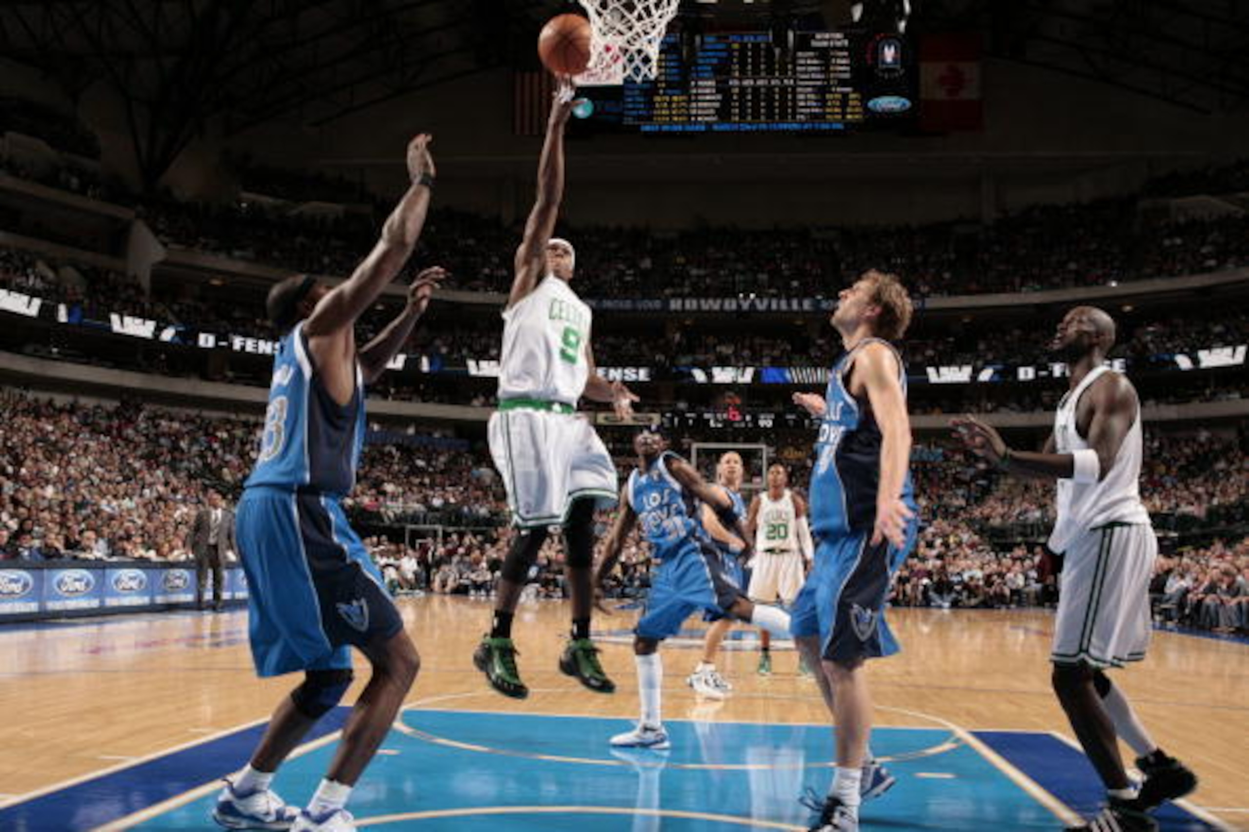 DALLAS - MARCH 20: Rajon Rondo #9 of the Boston Celtics goes in for the lay up against Brendan Haywood #33 and Dirk Nowitzki #41 of the Dallas Mavericks during a game at the American Airlines Center on March 20, 2010 in Dallas, Texas. NOTE TO USER: User e