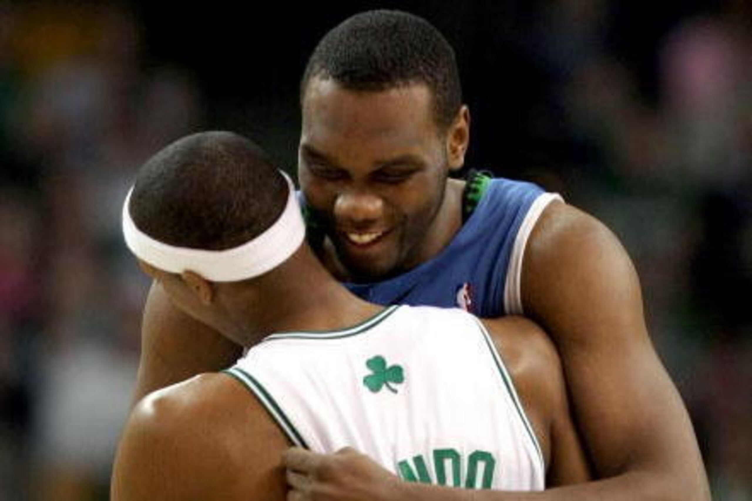 BOSTON - FEBRUARY 01:  Al Jefferson #25 of Minnesota Timberwolves and  Rajon Rondo #9 of the Boston Celtics greet each other before the game on February 1, 2009 at TD Banknorth Garden in Boston, Massachusetts. NOTE TO USER: User expressly acknowledges and