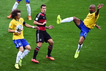 BELO HORIZONTE, BRAZIL - JULY 08: Miroslav Klose of Germany is challenged by David Luiz (L) and Maicon of Brazil during the 2014 FIFA World Cup Brazil Semi Final match between Brazil and Germany at Estadio Mineirao on July 8, 2014 in Belo Horizonte, Brazi