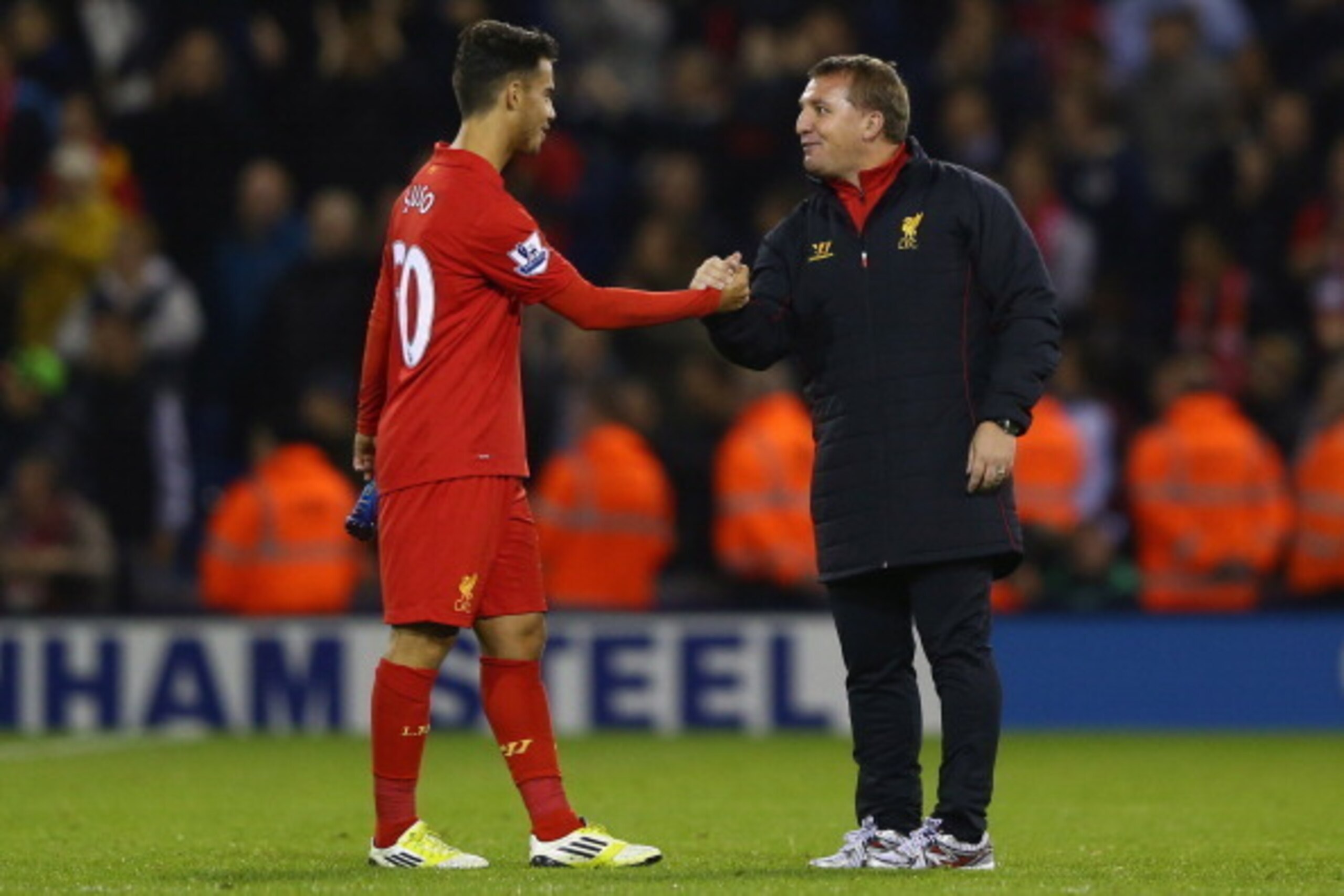WEST BROMWICH, ENGLAND - SEPTEMBER 26: Suso (L) of Liverpool shakes hands with manager Brendan Rodgers (R) after his sides 2-1 victory during the Capital One Cup Third Round match between West Bromwich Albion and Liverpool at The Hawthorns on September 26
