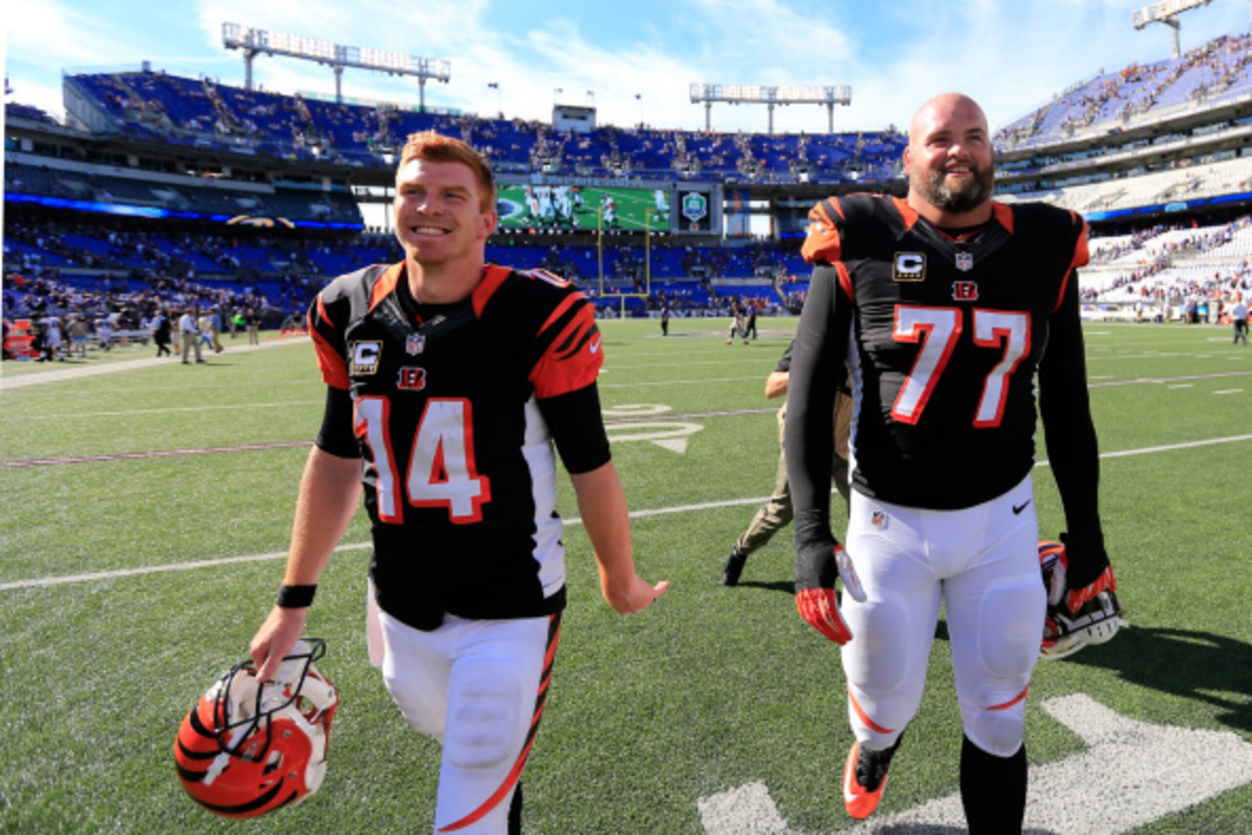 BALTIMORE, MD - SEPTEMBER 07: Quarterback Andy Dalton #14 and tackle Andrew Whitworth #77 of the Cincinnati Bengals walk off the field following the Bengals 23-16 win over the Baltimore Ravens during an NFL football game at M&T Bank Stadium on September 7