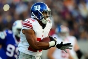 Aug 3, 2014; Canton, OH, USA; New York Giants running back Rashad Jennings (23) runs the ball during the first quarter of the 2014 Pro Football Hall of Fame game against the Buffalo Bills at Fawcett Stadium. Mandatory Credit: Andrew Weber-USA TODAY Sports