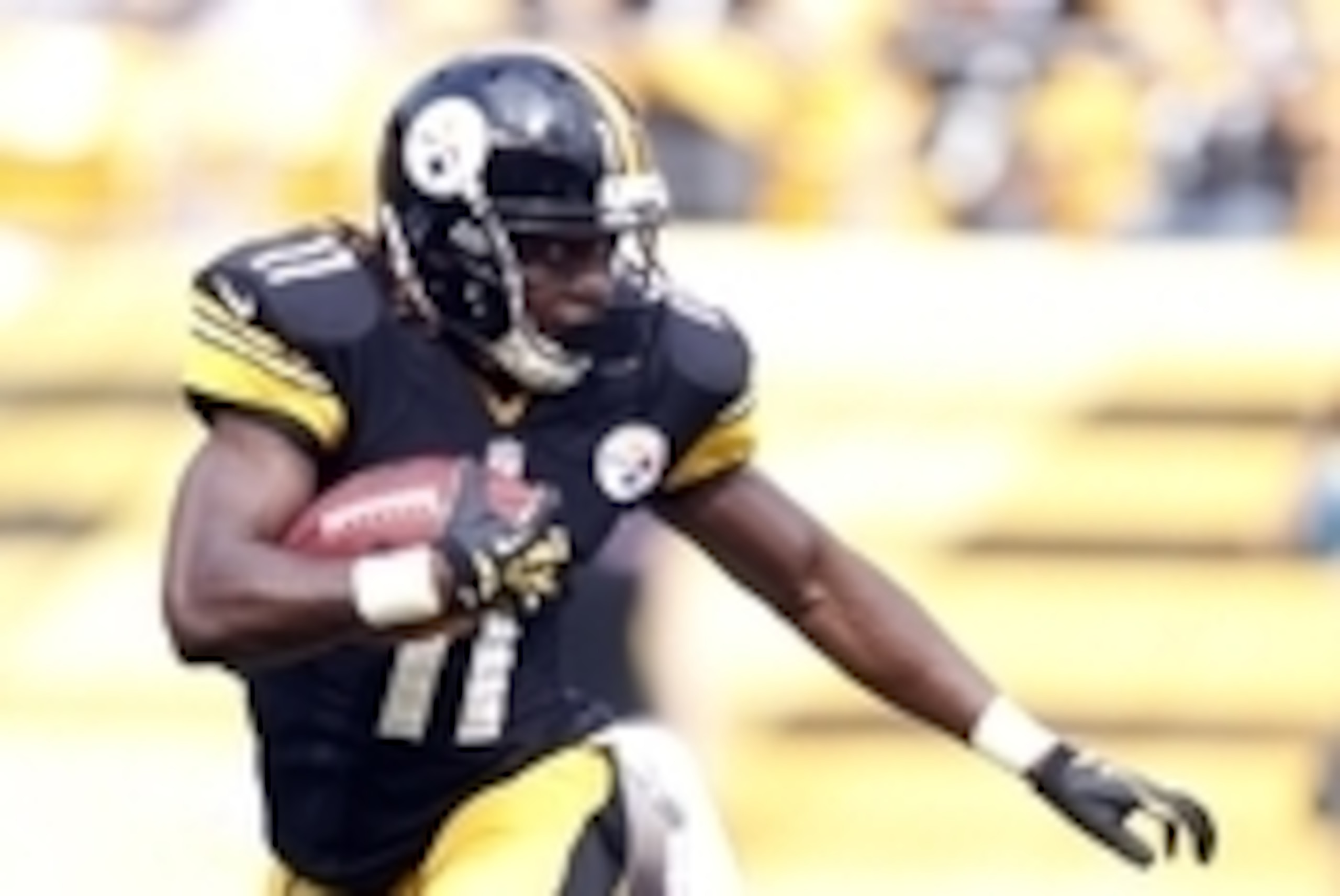 Sep 8, 2013; Pittsburgh, PA, USA; Pittsburgh Steelers wide receiver Markus Wheaton (11) returns a kick-off against the Tennessee Titans during the fourth quarter at Heinz Field. The Tennessee Titans won 16-9. Mandatory Credit: Charles LeClaire-USA TODAY S