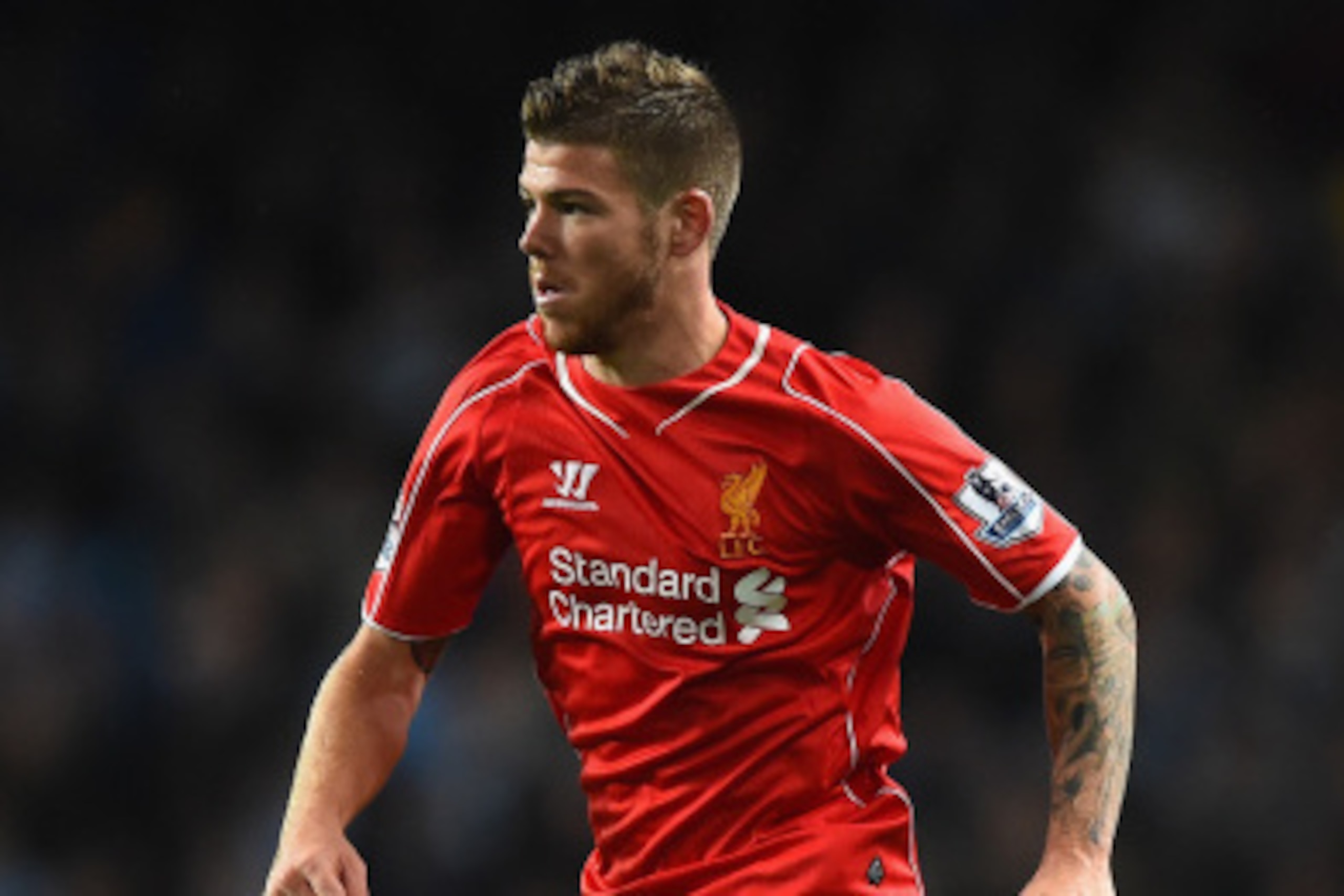 MANCHESTER, ENGLAND - AUGUST 25:   Alberto Moreno of Liverpool  in action during the Barclays Premier League match between Manchester City and Liverpool at the Etihad Stadium on August 25, 2014 in Manchester, England.  (Photo by Laurence Griffiths/Getty I