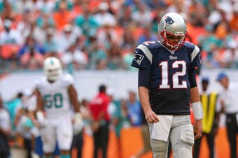 MIAMI GARDENS, FL - SEPTEMBER 07:  Tom Brady #12 of the New England Patriots looks on during a game against the Miami Dolphins at Sun Life Stadium on September 7, 2014 in Miami Gardens, Florida.  (Photo by Mike Ehrmann/Getty Images)