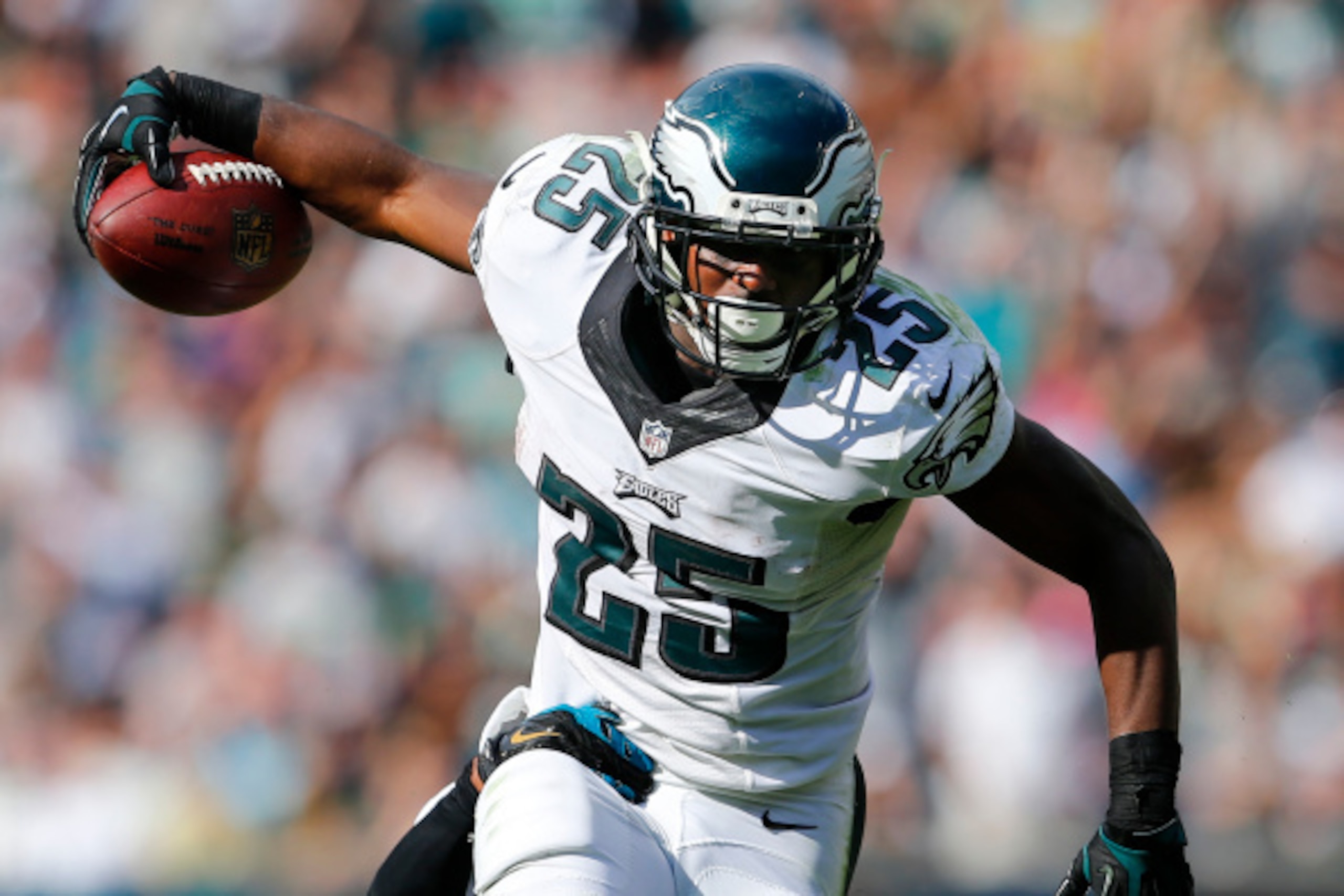 PHILADELPHIA, PA - SEPTEMBER 07:  LeSean McCoy #25 of the Philadelphia Eagles runs for a first down as Josh Evans #26 of the Jacksonville Jaguars attempts a tackle during the fourth quarter of a NFL game at Lincoln Financial Field on September 7, 2014 in 