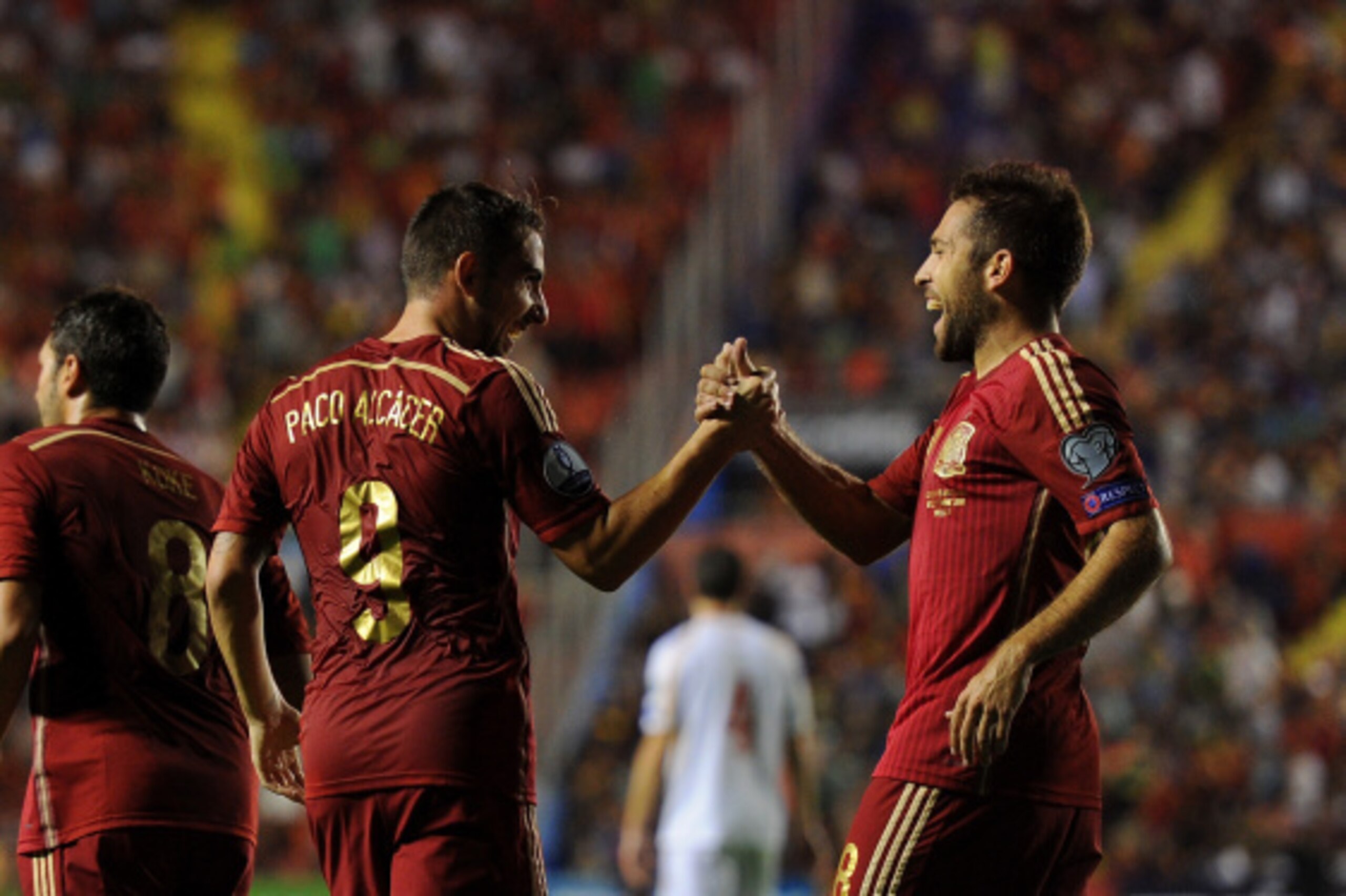VALENCIA, SPAIN - SEPTEMBER 08:  Paco Alcacer celebrates with Jordi Alba after scoring Spain's 2nd goal during the UEFA EURO 2016 Group C Qualifier between Spain and FYR  of Macedonia at Estadio Ciutat de Valencia on September 8, 2014 in Valencia, Spain. 