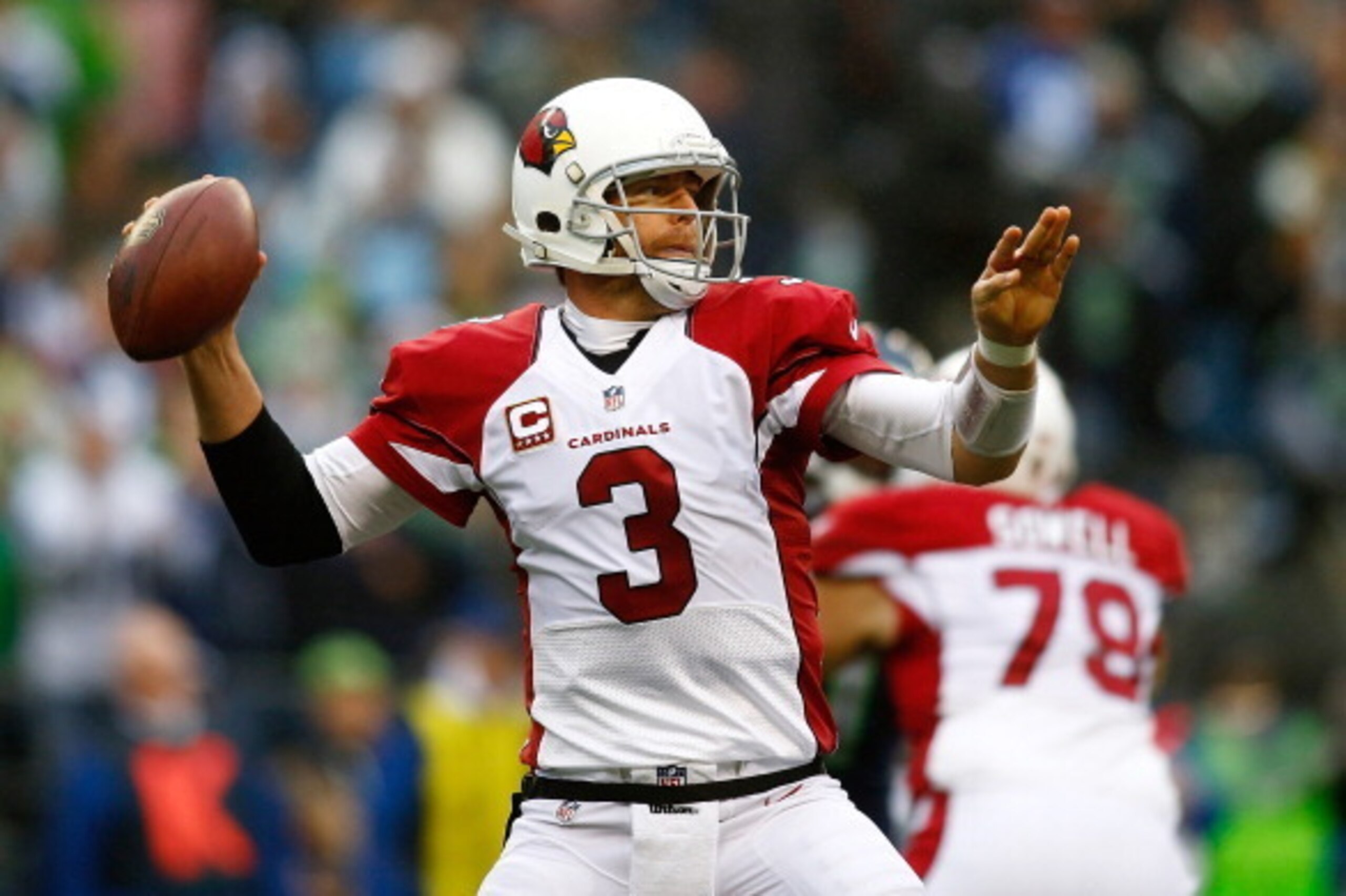 SEATTLE - DECEMBER 22: Carson Palmer #3 of the Arizona Cardinals throws a pass against the Seattle Seahawks on December 22, 2013 at CenturyLink Field in Seattle, Washington.  (Photo by Jonathan Ferrey/Getty Images)