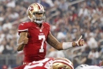Sep 7, 2014; Arlington, TX, USA; San Francisco 49ers quarterback Colin Kaepernick (7) signals a play in the second quarter against the Dallas Cowboys  at AT&T Stadium. Mandatory Credit: Tim Heitman-USA TODAY Sports