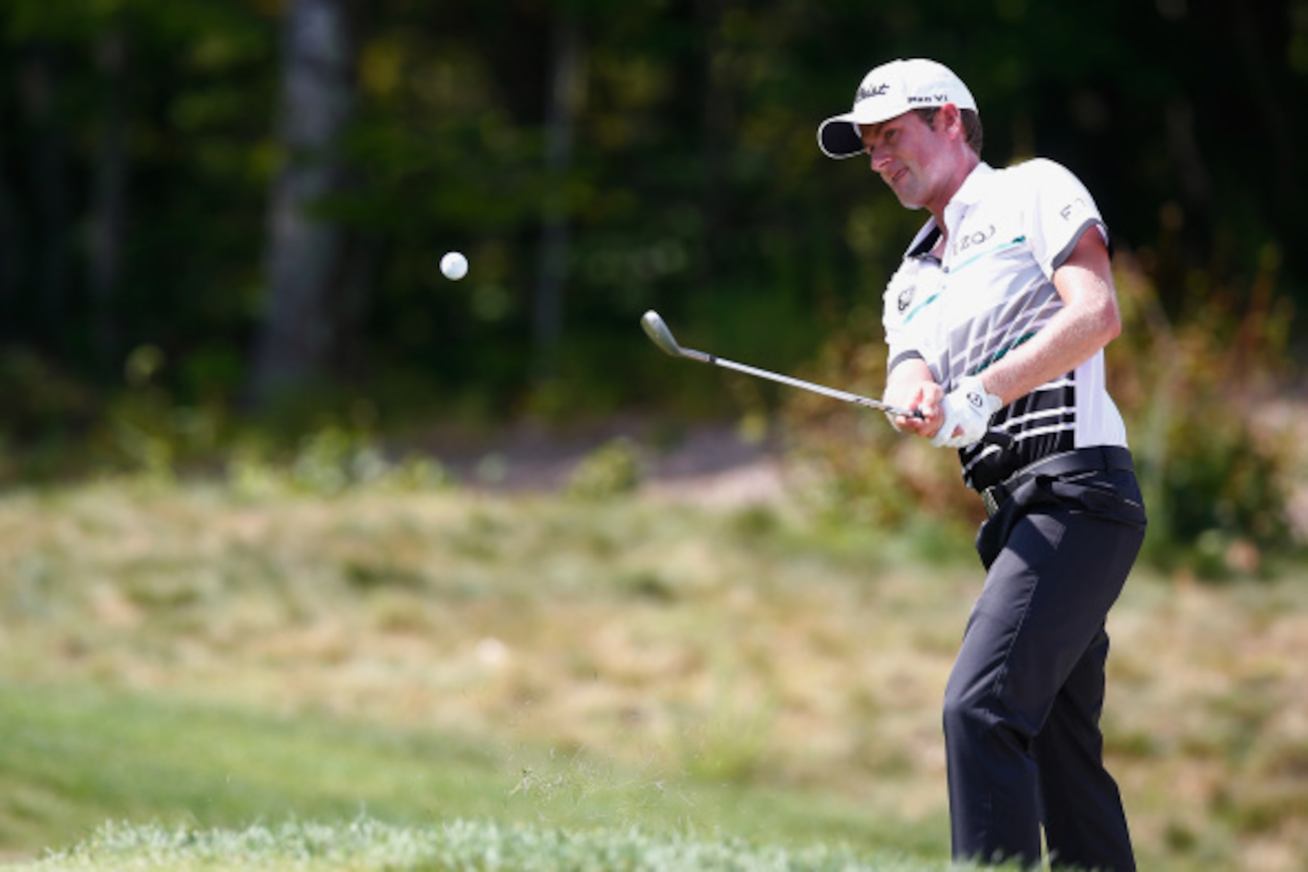 NORTON, MA - SEPTEMBER 01:  Webb Simpson takes his shot out of the bunker on the third hole during the final round of the Deutsche Bank Championship at the TPC Boston on September 1, 2014 in Norton, Massachusetts.  (Photo by Jared Wickerham/Getty Images)