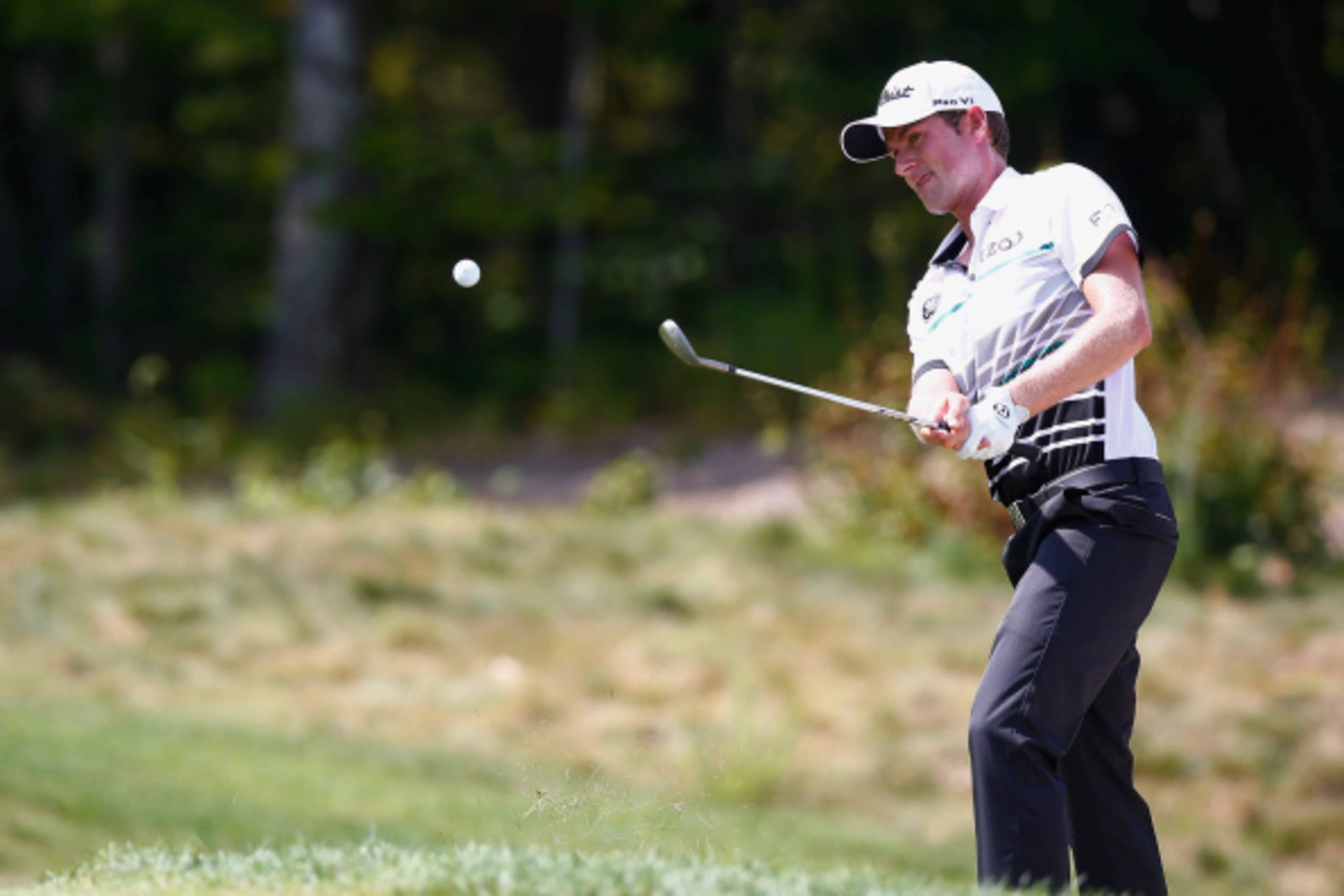 NORTON, MA - SEPTEMBER 01:  Webb Simpson takes his shot out of the bunker on the third hole during the final round of the Deutsche Bank Championship at the TPC Boston on September 1, 2014 in Norton, Massachusetts.  (Photo by Jared Wickerham/Getty Images)