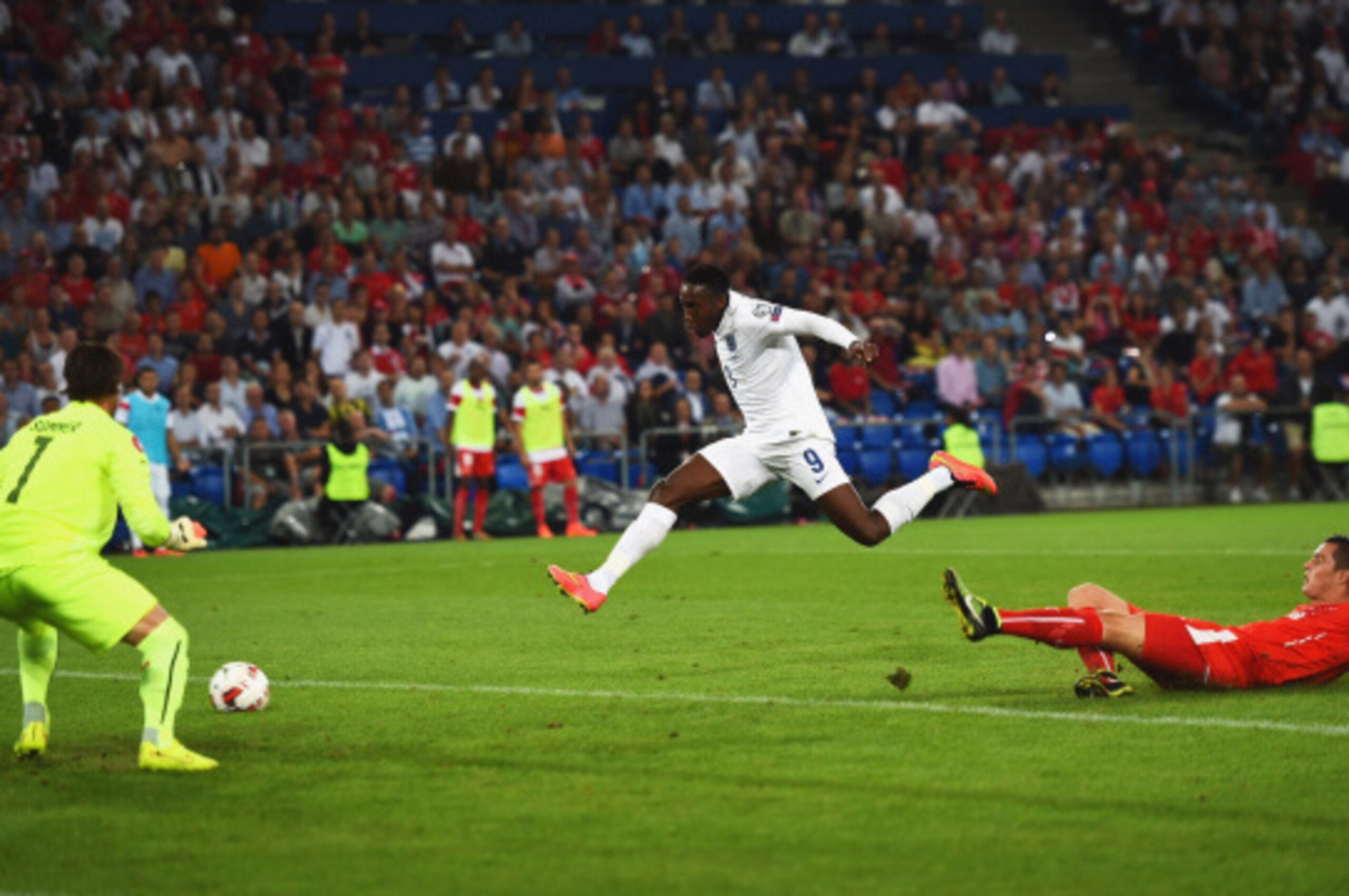 BASEL, SWITZERLAND - SEPTEMBER 08:  Danny Welbeck of England (9) shoots past goalkeeper Yann Sommer of Switzerland to score their first goal during the UEFA EURO 2016 Group E qualifying match between Switzerland and England at St Jakob-Park on September 8
