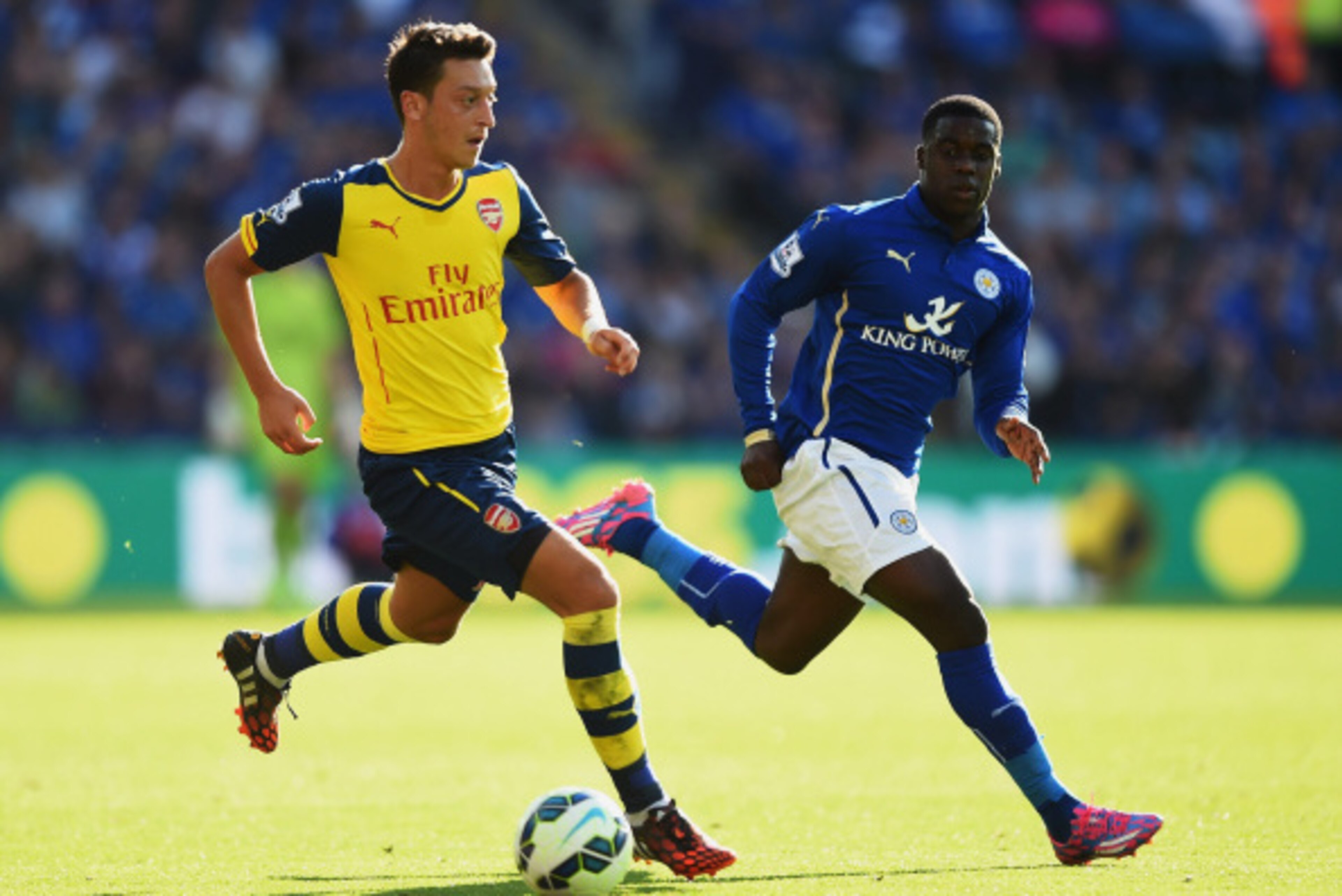 LEICESTER, ENGLAND - AUGUST 31: Mesut Oezil of Arsenal is closed down by Jeffrey Schlupp of Leicester City during the Barclays Premier League match between Leicester City and Arsenal at The King Power Stadium on August 31, 2014 in Leicester, England. (P LEICESTER, ENGLAND - AUGUST 31: Mesut Oezil of Arsenal is closed down by Jeffrey Schlupp of Leicester City during the Barclays Premier League match between Leicester City and Arsenal at The King Power Stadium on August 31, 2014 in Leicester, England. (P